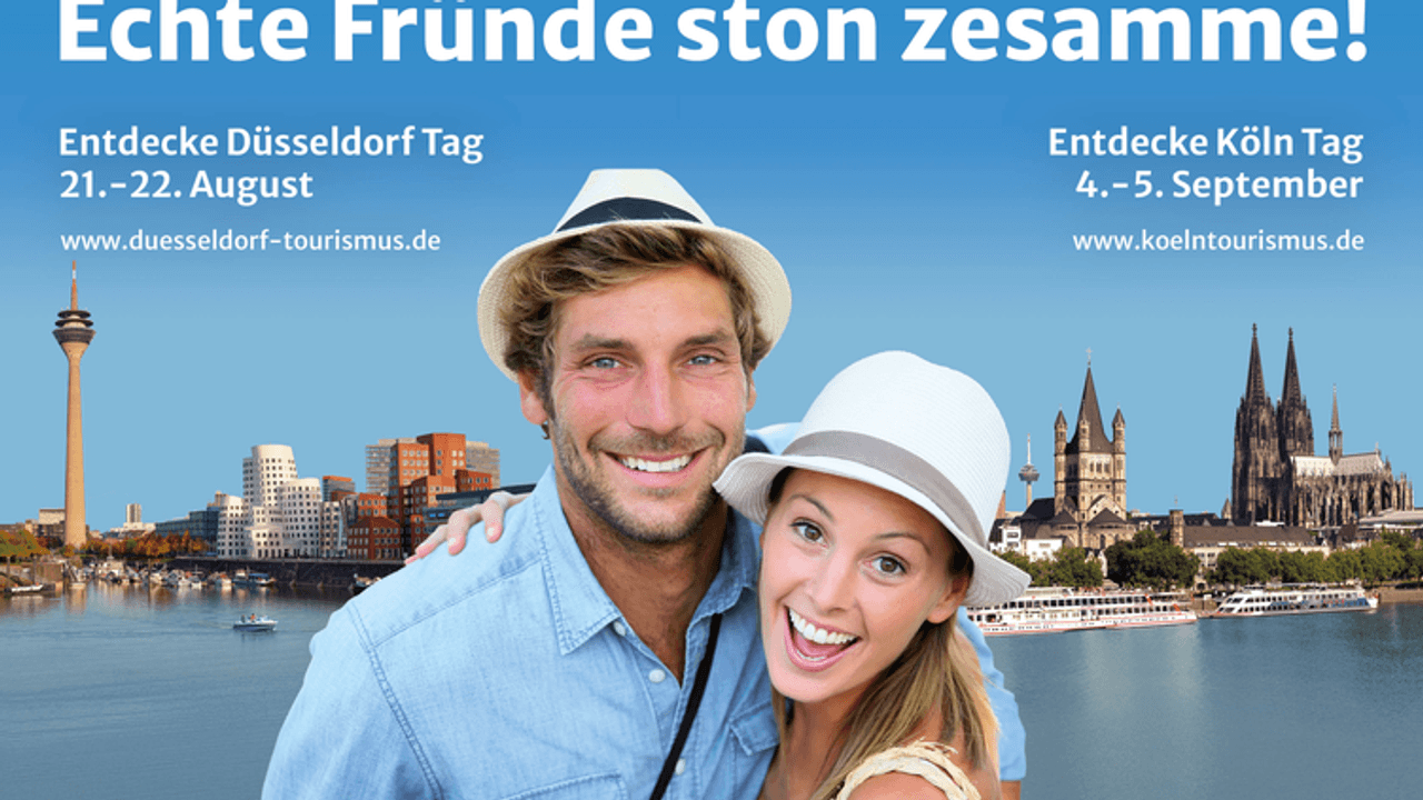 Köln und Düsseldorf machen gemeinsam Werbung mit einem Pärchen vor den Stadt-Panoramen für Tourismus in den Städten.