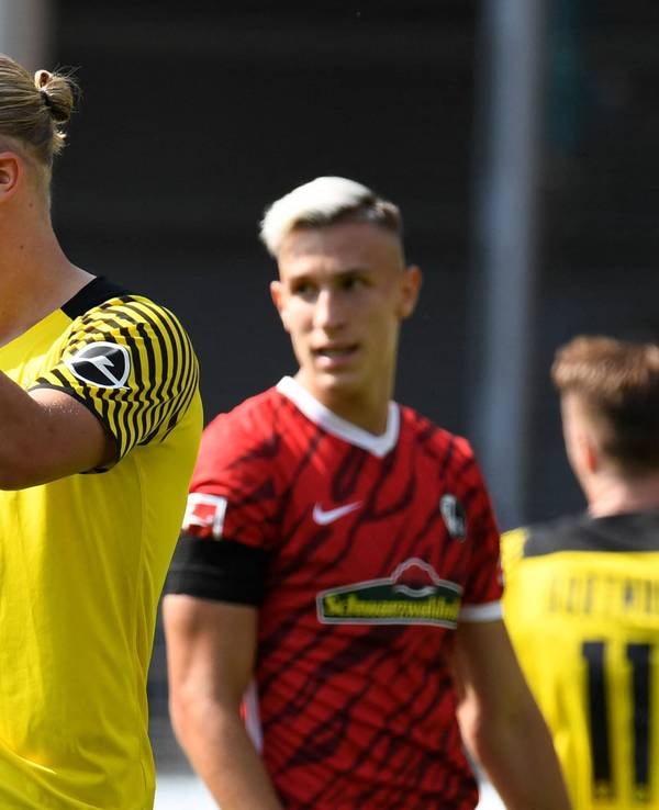 Dortmund's Norwegian forward Erling Braut Haaland reacts during the German first division Bundesliga football match SC Freiburg v Borussia Dortmund in Freiburg, southwestern Germany on August 21, 2021. (Photo by Thomas KIENZLE / AFP) / DFL REGULATIONS PROHIBIT ANY USE OF PHOTOGRAPHS AS IMAGE SEQUENCES AND/OR QUASI-VIDEO