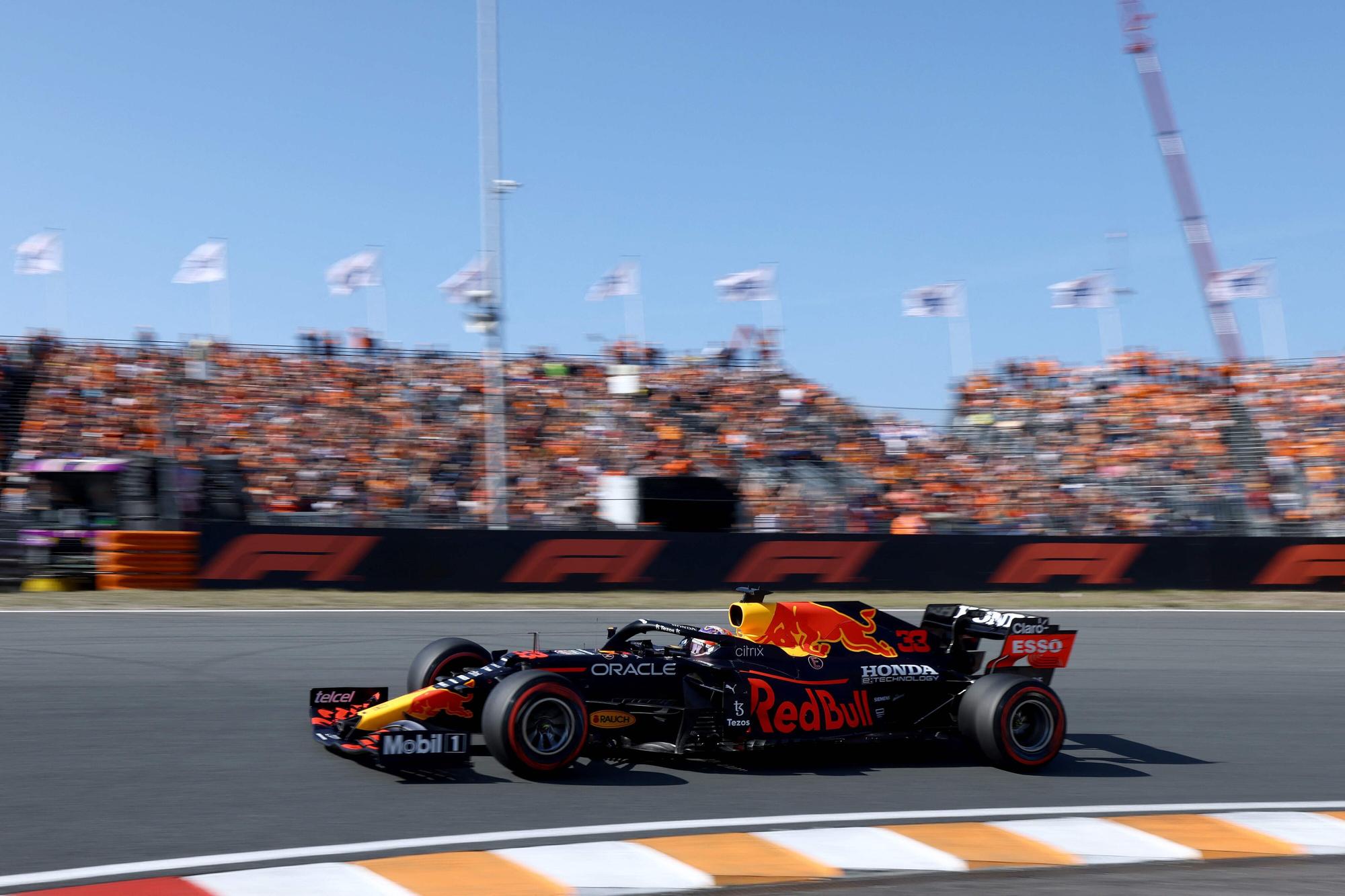 Red Bull's Dutch driver Max Verstappen races at the Zandvoort circuit during the qualifying session of the Netherlands' Formula One Grand Prix in Zandvoort on September 4, 2021. (Photo by Kenzo Tribouillard / AFP)