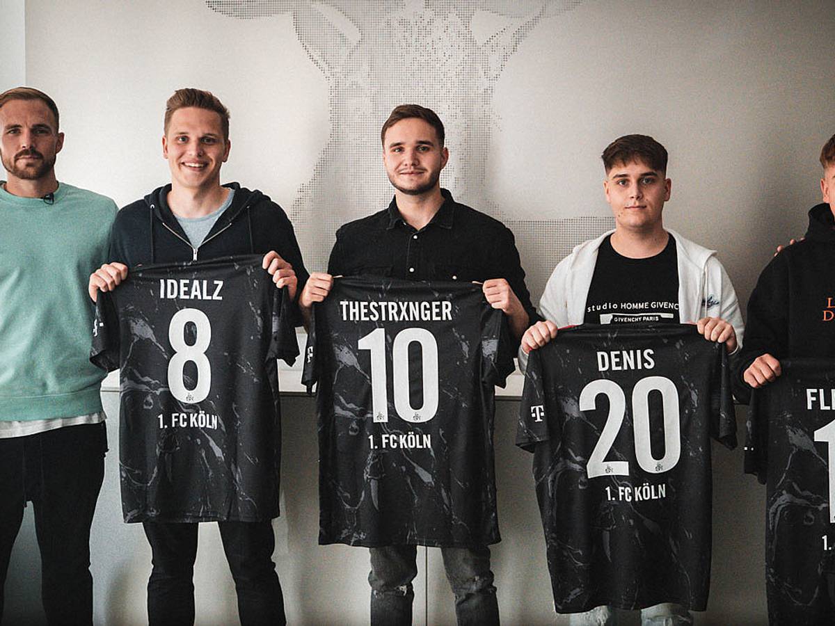 Rafael Czichos, Lukas Schmandt, Tim Katnawatos, Denis Müller, Felix Günther und Jannes Horn posieren mit den E-Sport-Trikots des 1. FC Köln. Foto von der Website des 1. FC Köln