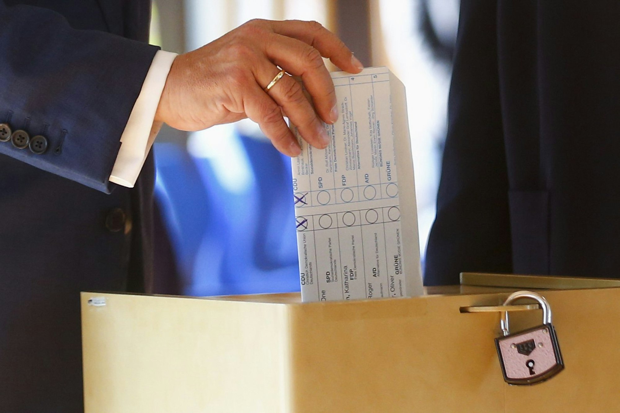 Armin Laschet, Christian Union parties candidate for Chancellery and Minister President of North Rhine-Westphalia, casts his ballot for the German parliament election in Aachen, Germany, Sunday, Sept. 26, 2021. German voters are choosing a new parliament in an election that will determine who succeeds Chancellor Angela Merkel after her 16 years at the helm of Europe’s biggest economy. (Thilo Schmuelgen/Pool via AP)