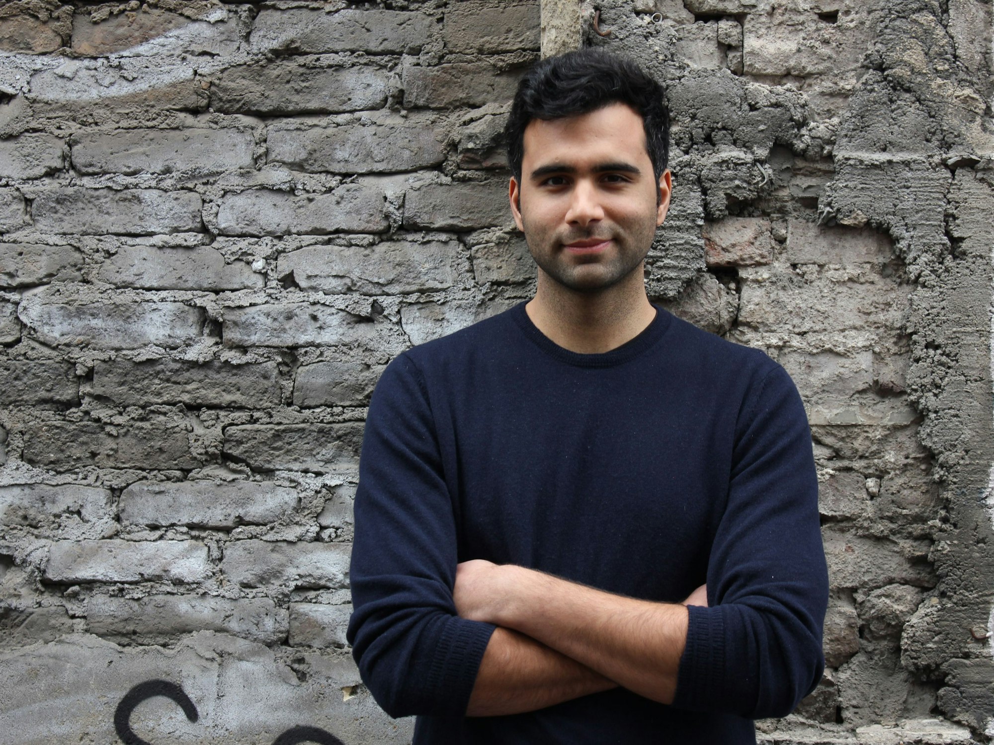 Userlike-Chef Timoor Taufig verschränkt die Arme.