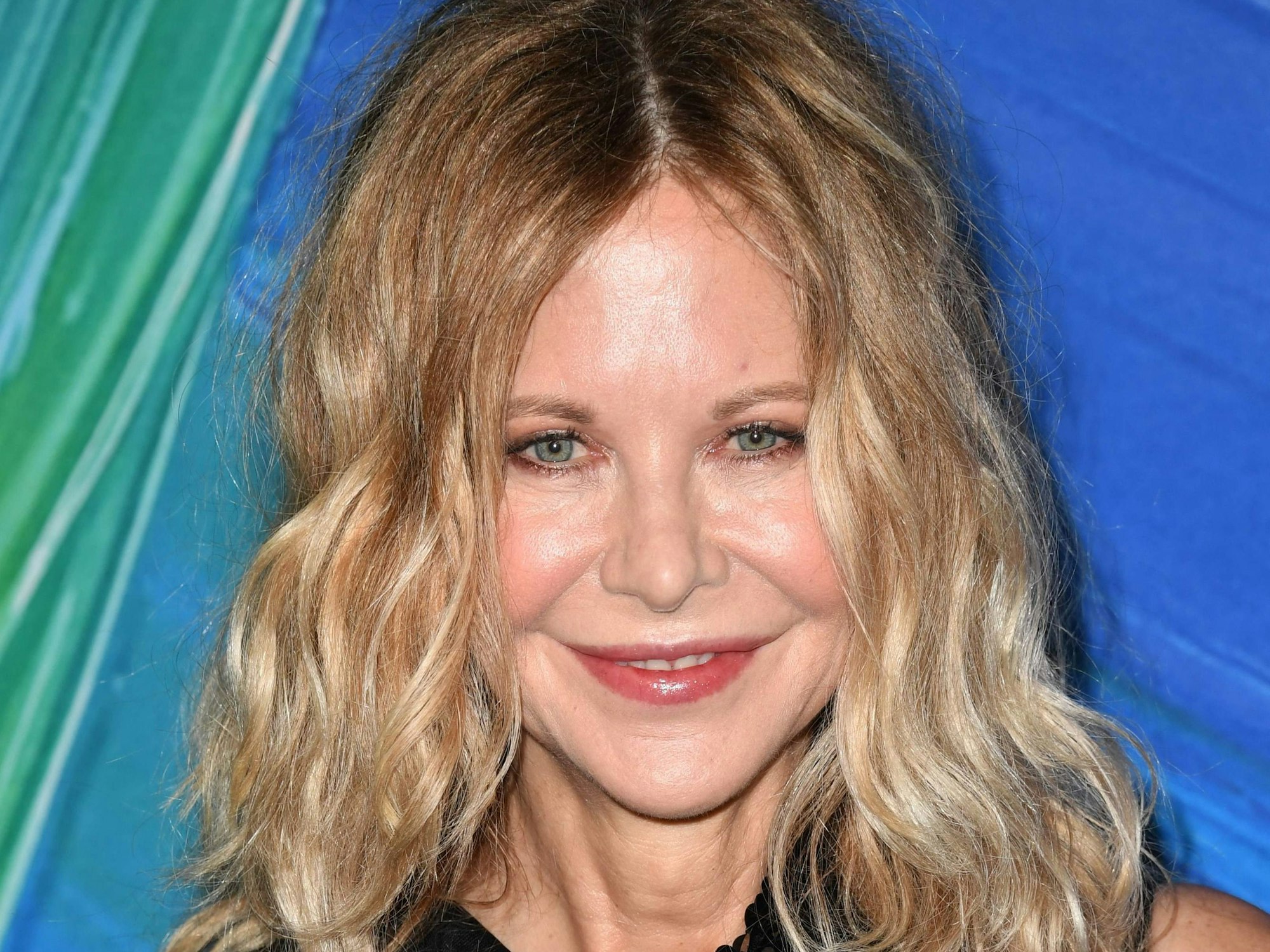 US actor Meg Ryan arrives for the 11th annual amfAR Gala Los Angeles at the Pacific Design Center in West Hollywood, California, November 4, 2021. (Photo by Robyn Beck / AFP)