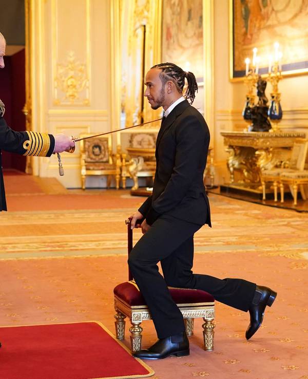 Lewis Hamilton is made a Knight Bachelor by Britain's Prince Charles at Windsor Castle, in Windsor, England, Wednesday, Dec. 15, 2021. (Dominic Lipinski/PA via AP)