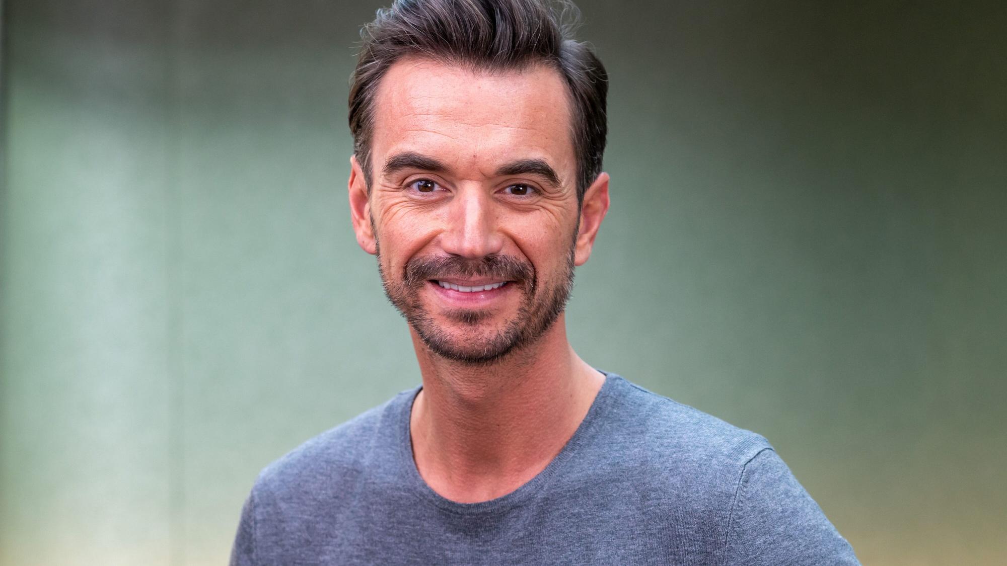 Florian Silbereisen lächelt bei einem Fototermin im Hotel Bayerischer Hof.