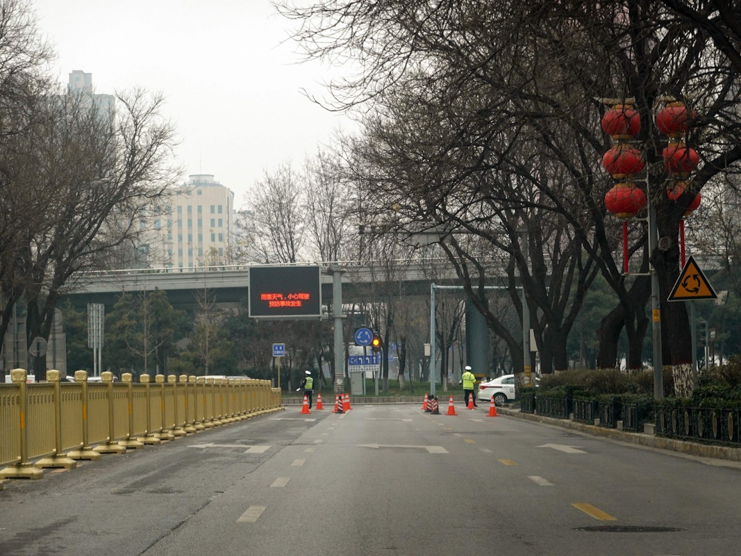 This picture shows an empty road in Xi'an in China's northern Shaanxi province on December 31, 2021, amid a Covid-19 coronavirus lockdown. (Photo by AFP) / China OUT