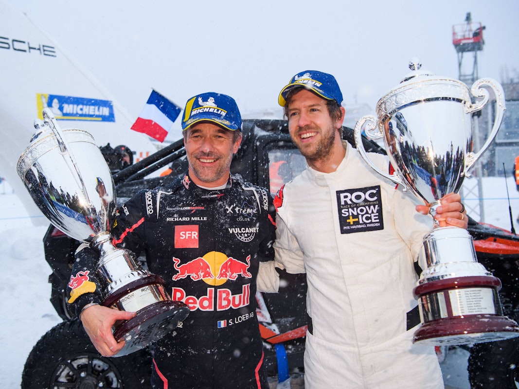 Sebastien Loeb und Sebastian Vettel bei der Siegerehrung.