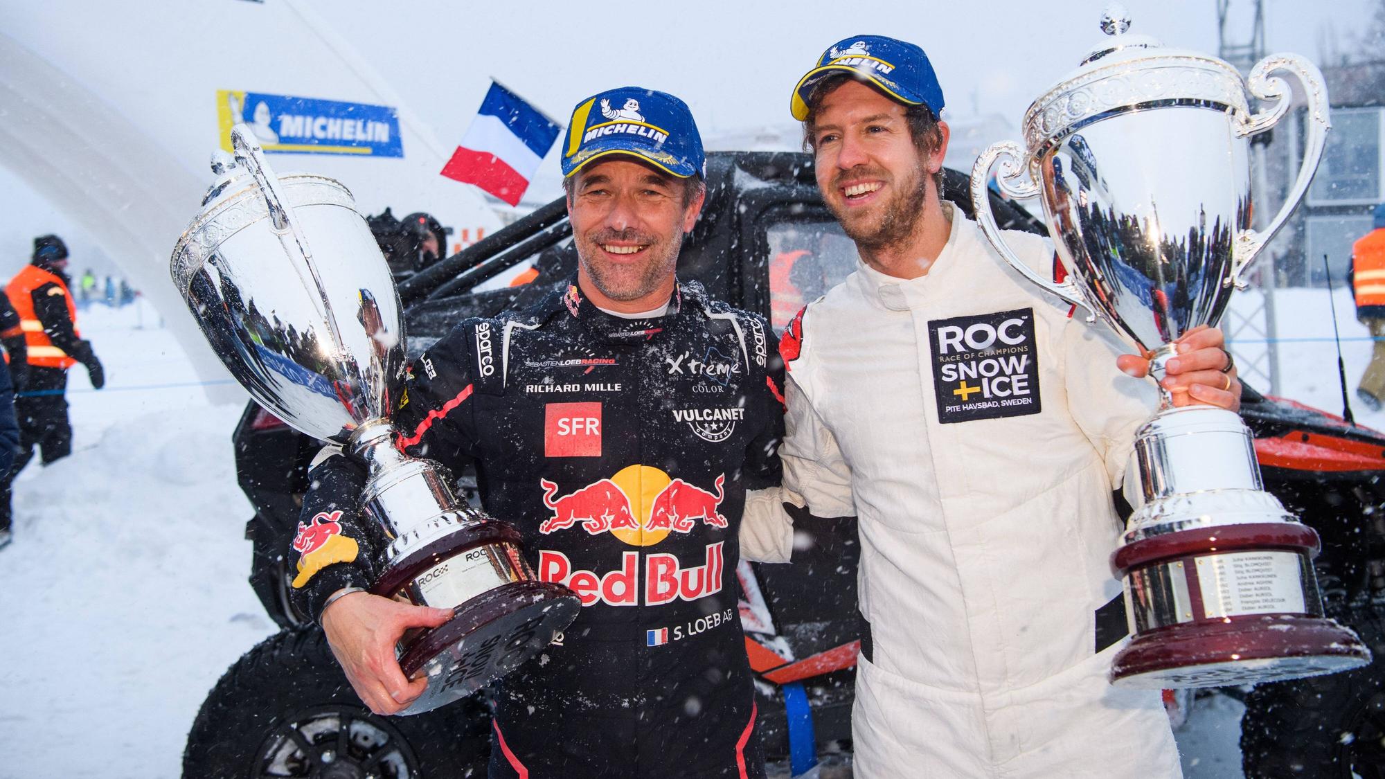 Sebastien Loeb und Sebastian Vettel bei der Siegerehrung.