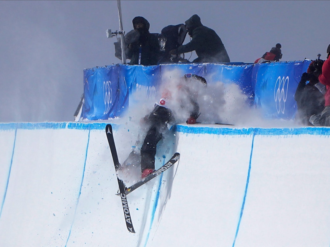 Britain's Gus Kenworthy crashes during the men's halfpipe finals at the 2022 Winter Olympics, Saturday, Feb. 19, 2022, in Zhangjiakou, China. (AP Photo/Gregory Bull)