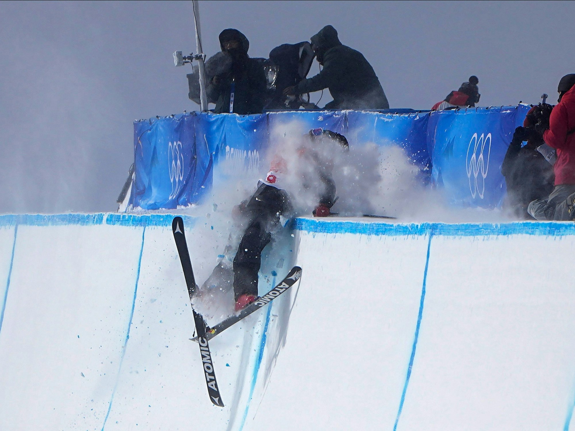 Britain's Gus Kenworthy crashes during the men's halfpipe finals at the 2022 Winter Olympics, Saturday, Feb. 19, 2022, in Zhangjiakou, China. (AP Photo/Gregory Bull)