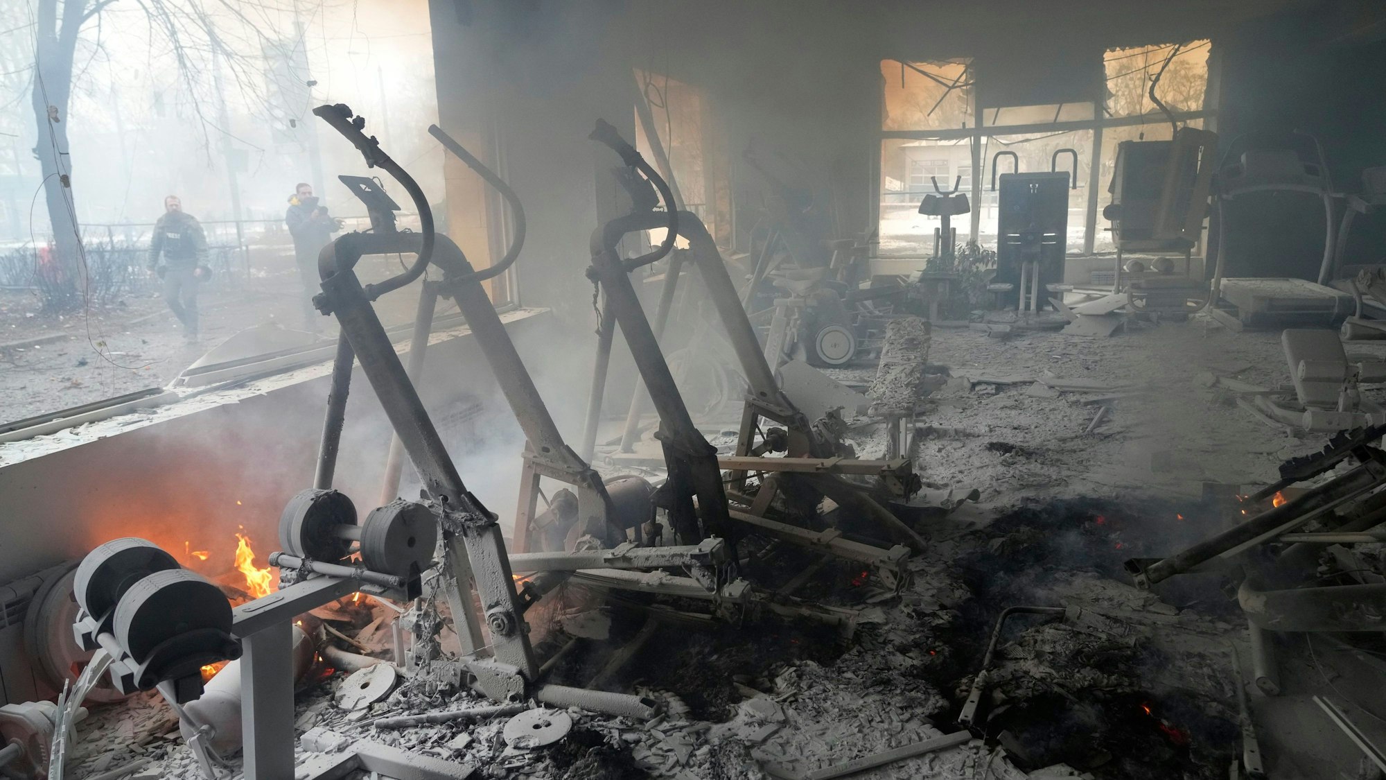A view of smoke from inside a damaged gym following shelling in Kyiv, Ukraine, Wednesday, March 2, 2022. Russian forces have escalated their attacks on crowded cities in what Ukraine's leader called a blatant campaign of terror. (AP Photo/Efrem Lukatsky)
