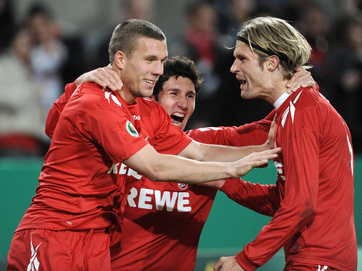 Stephan Salger jubelt mit Lukas Podolski und Martin Lanig.