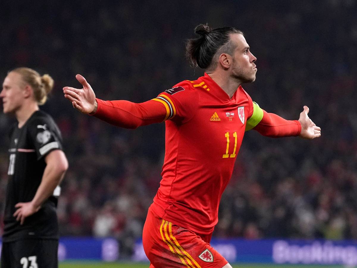 Wales' Gareth Bale celebrates after scoring his side's second goal during the World Cup 2022 playoff soccer match between Wales and Austria at Cardiff City stadium, in Cardiff, Britain, Thursday, March 24, 2022. (AP Photo/Matt Dunham)