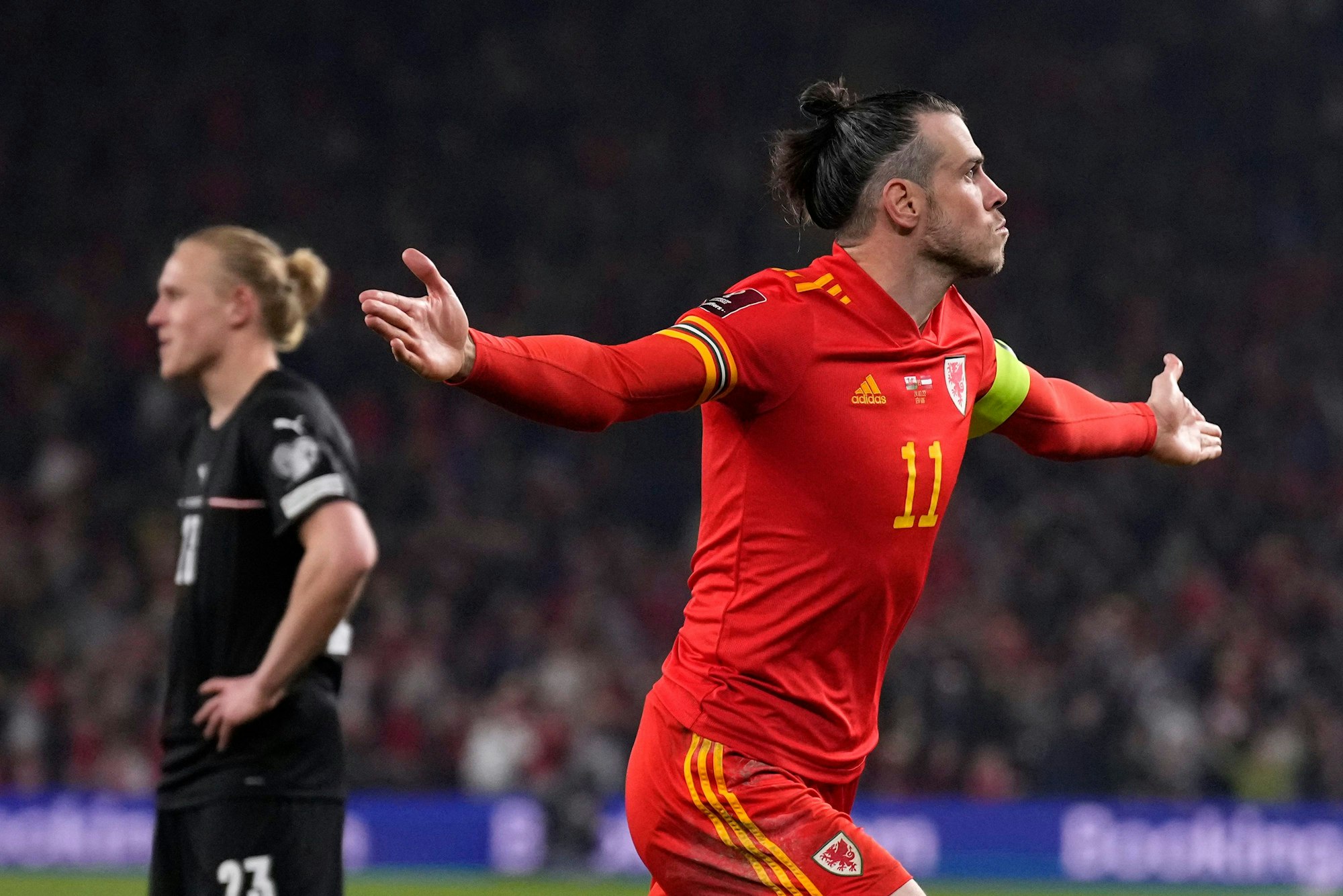 Wales' Gareth Bale celebrates after scoring his side's second goal during the World Cup 2022 playoff soccer match between Wales and Austria at Cardiff City stadium, in Cardiff, Britain, Thursday, March 24, 2022. (AP Photo/Matt Dunham)