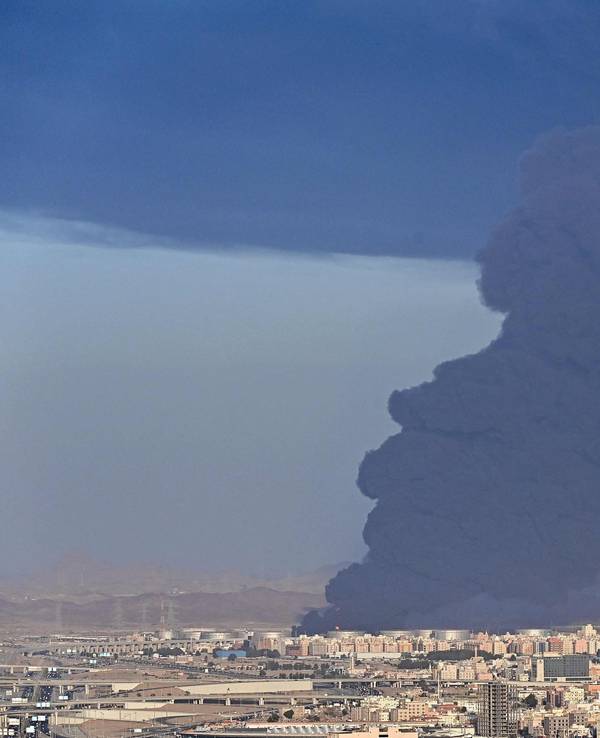 Smoke billows from an oil storage facility in Saudi Arabia's Red Sea coastal city of Jeddah on March 25, 2022. (Photo by ANDREJ ISAKOVIC / AFP)