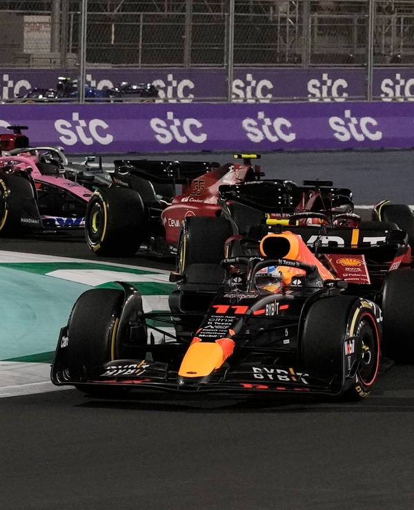 Red Bull driver Sergio Perez of Mexico leads at the start of the Formula One Grand Prix it in Jiddah, Saudi Arabia, Sunday, March 27, 2022. (AP Photo/Hassan Ammar)