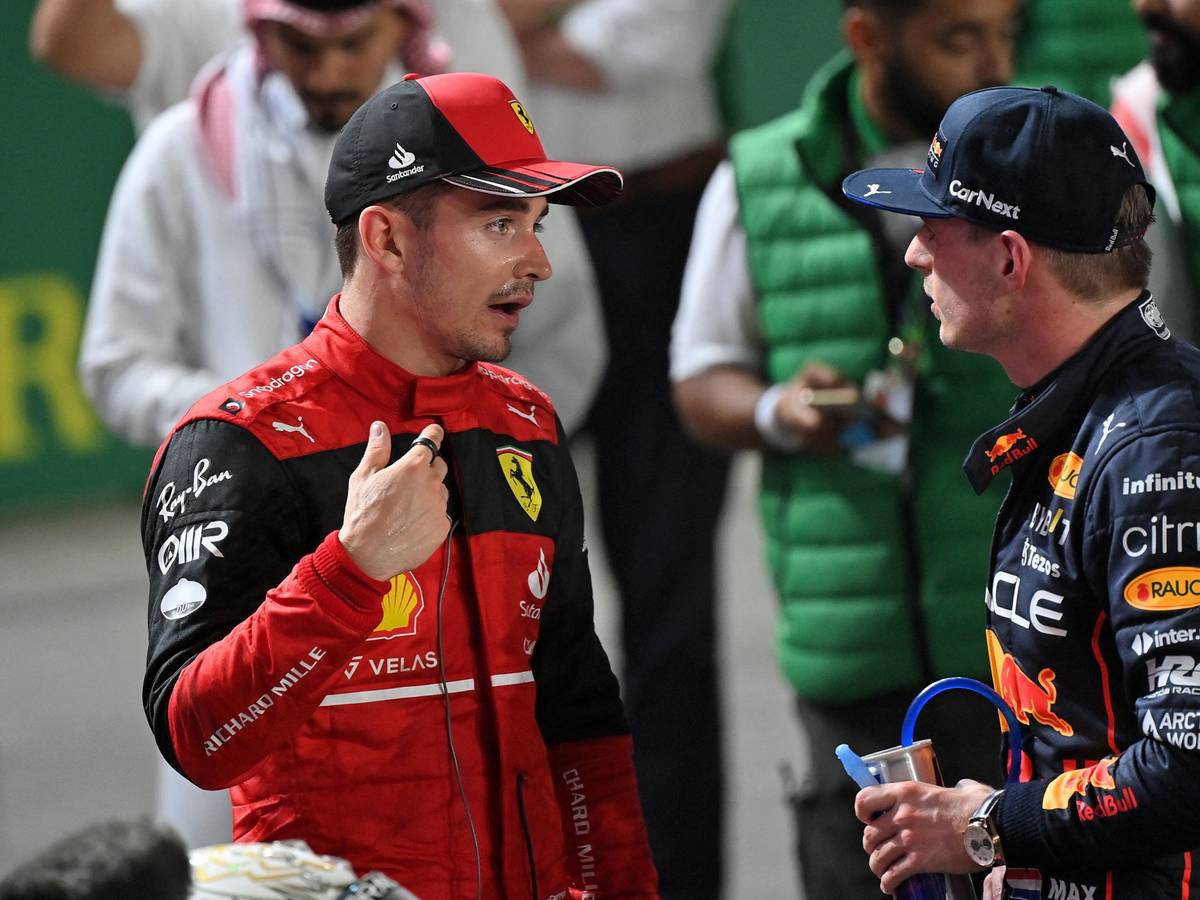 Ferrari's Monegasque driver Charles Leclerc (L) chats with Red Bull's Dutch driver Max Verstappen (R) after the 2022 Saudi Arabia Formula One Grand Prix at the Jeddah Corniche Circuit on March 27, 2022. (Photo by ANDREJ ISAKOVIC / AFP)