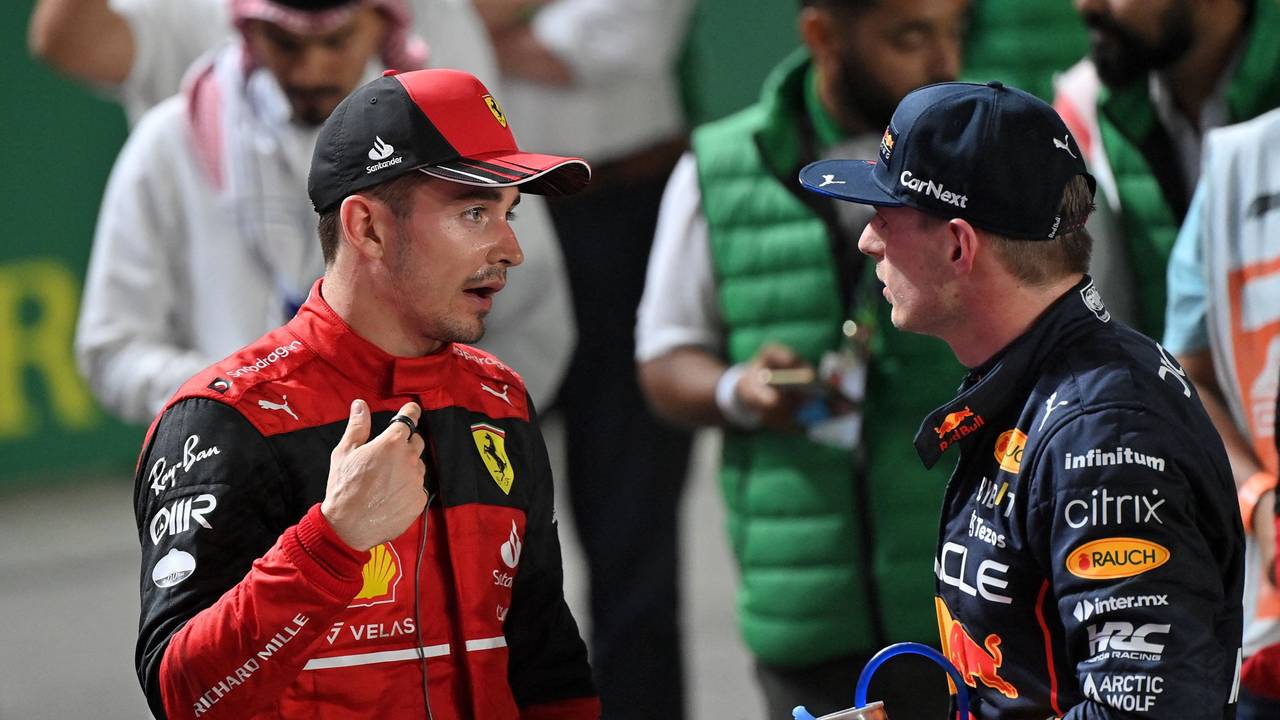 Ferrari's Monegasque driver Charles Leclerc (L) chats with Red Bull's Dutch driver Max Verstappen (R) after the 2022 Saudi Arabia Formula One Grand Prix at the Jeddah Corniche Circuit on March 27, 2022. (Photo by ANDREJ ISAKOVIC / AFP)