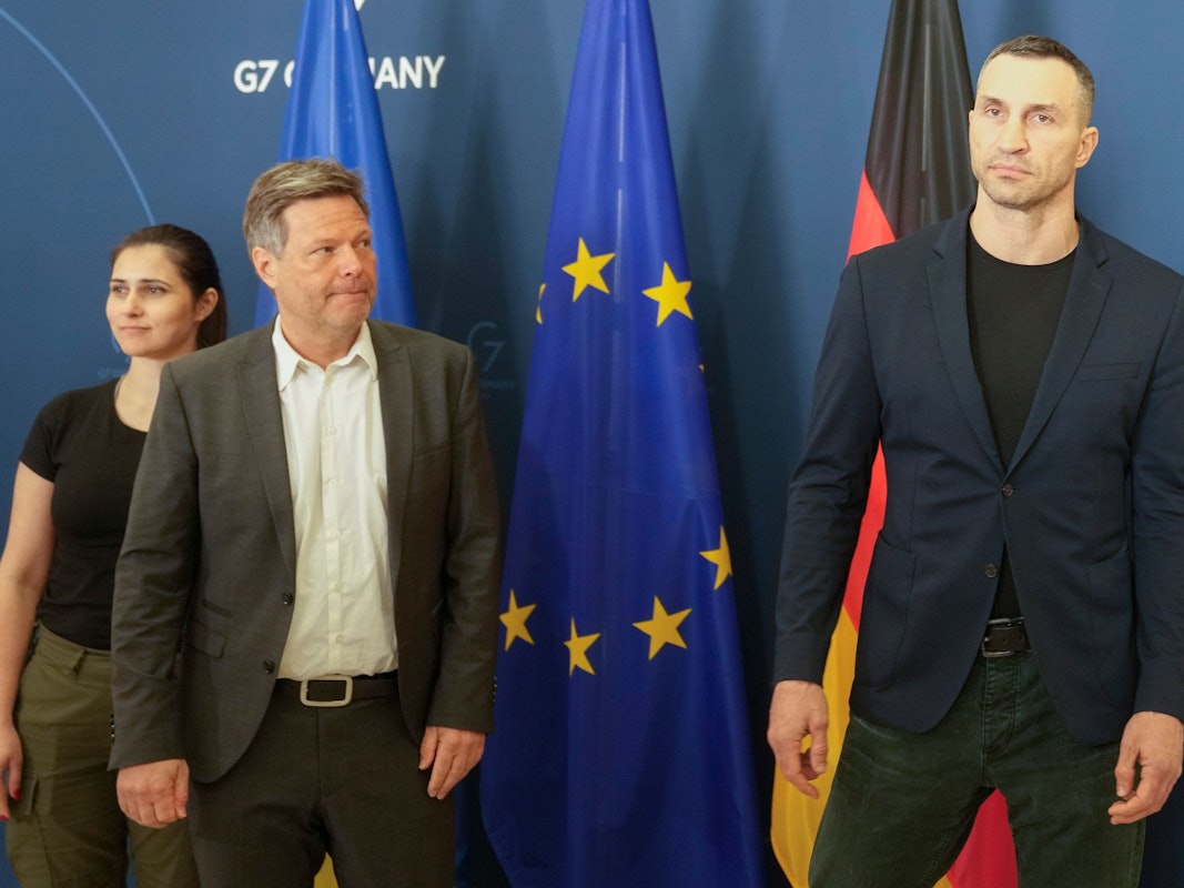 German Economy and Climate Minister Robert Habeck, center, welcomes former heavyweight boxing world champion Wladimir Klitschko, right, brother of Kyiv Mayor Vitali Klitschko, for talks in Berlin, Germany, Thursday, March 31, 2022. (AP Photo/Markus Schreiber)