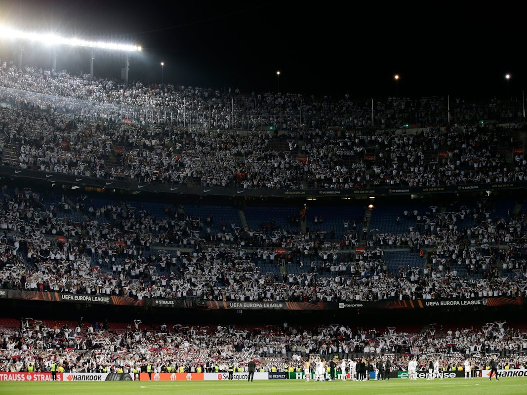 Eintracht Frankfurt players celebrate winning the Europa League, second leg, quarterfinal soccer match against Barcelona at the Camp Nou stadium, in Barcelona, Spain, Thursday, April 14, 2022. (AP Photo/Joan Monfort)