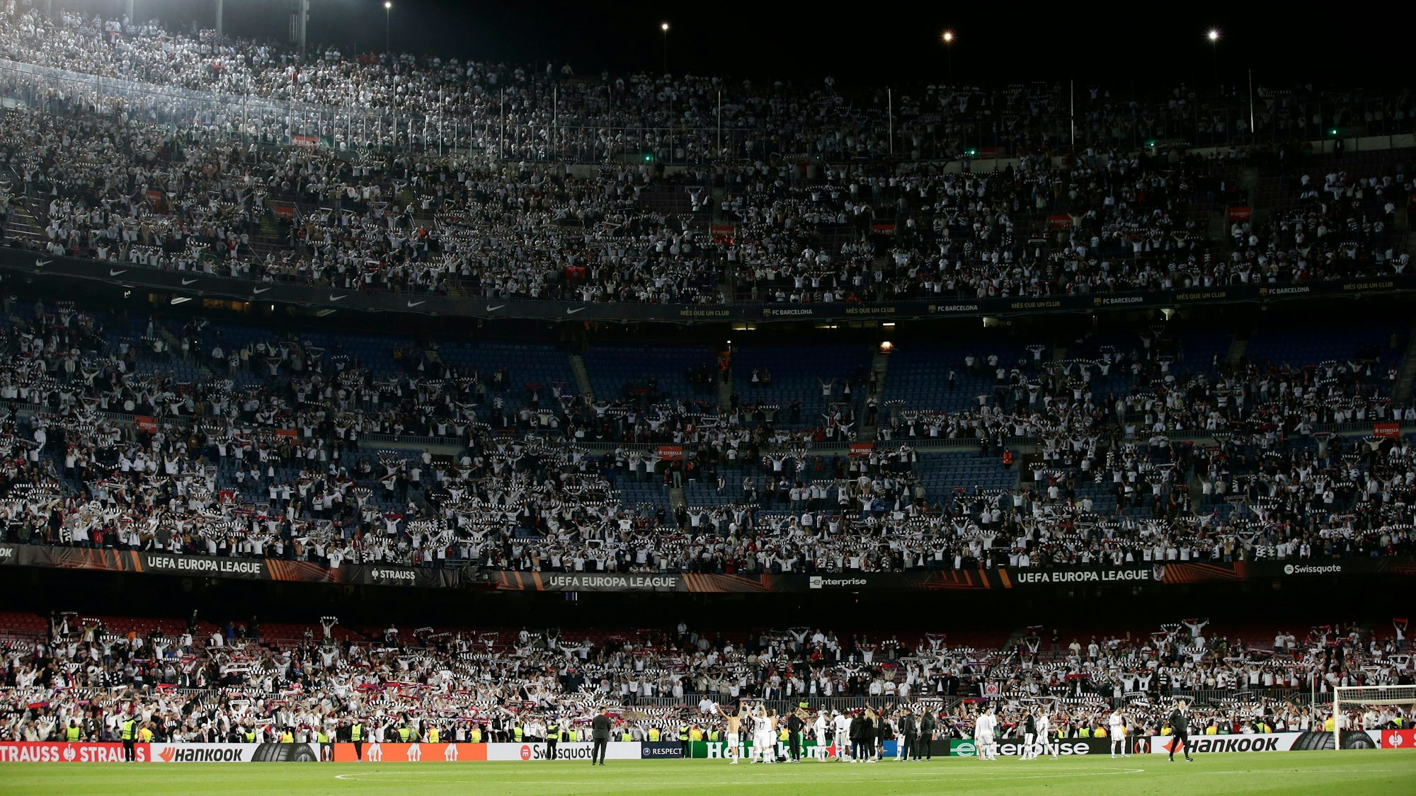 Eintracht Frankfurt players celebrate winning the Europa League, second leg, quarterfinal soccer match against Barcelona at the Camp Nou stadium, in Barcelona, Spain, Thursday, April 14, 2022. (AP Photo/Joan Monfort)