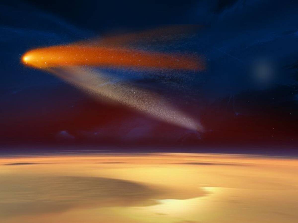 Das undatierte Bild der Nasa zeigt illustrativ, wie der Komet „Siding Spring“ in Rekordnähe am Mars vorbeiflog. Der Schweifstern passierte den Mars in nur knapp 140.000 Kilometer Entfernung.