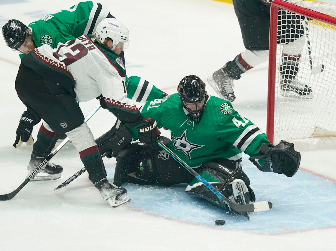 Arizona Coyotes center Nathan Smith (13) tries to score against Dallas Stars goaltender Scott Wedgewood (41) and defenseman Jani Hakanpaa (2) during the first period of an NHL hockey game in Dallas, Wednesday, April 27, 2022. (AP Photo/LM Otero)