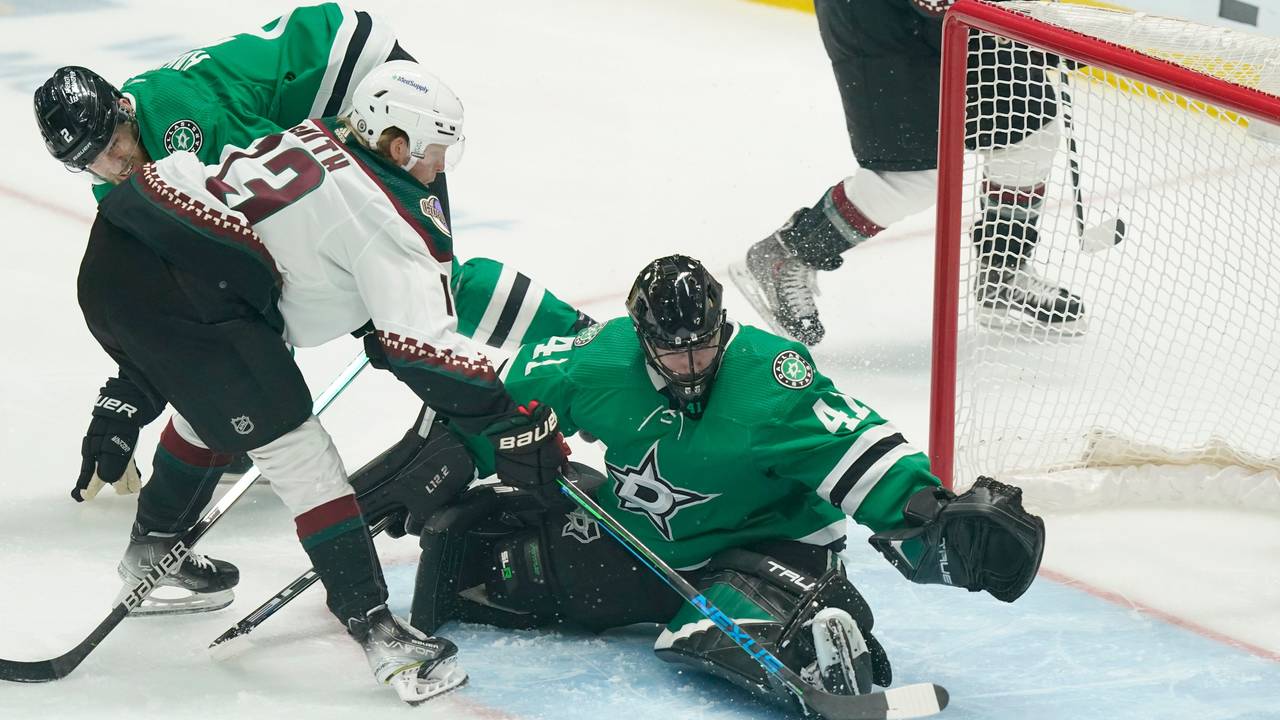Arizona Coyotes center Nathan Smith (13) tries to score against Dallas Stars goaltender Scott Wedgewood (41) and defenseman Jani Hakanpaa (2) during the first period of an NHL hockey game in Dallas, Wednesday, April 27, 2022. (AP Photo/LM Otero)