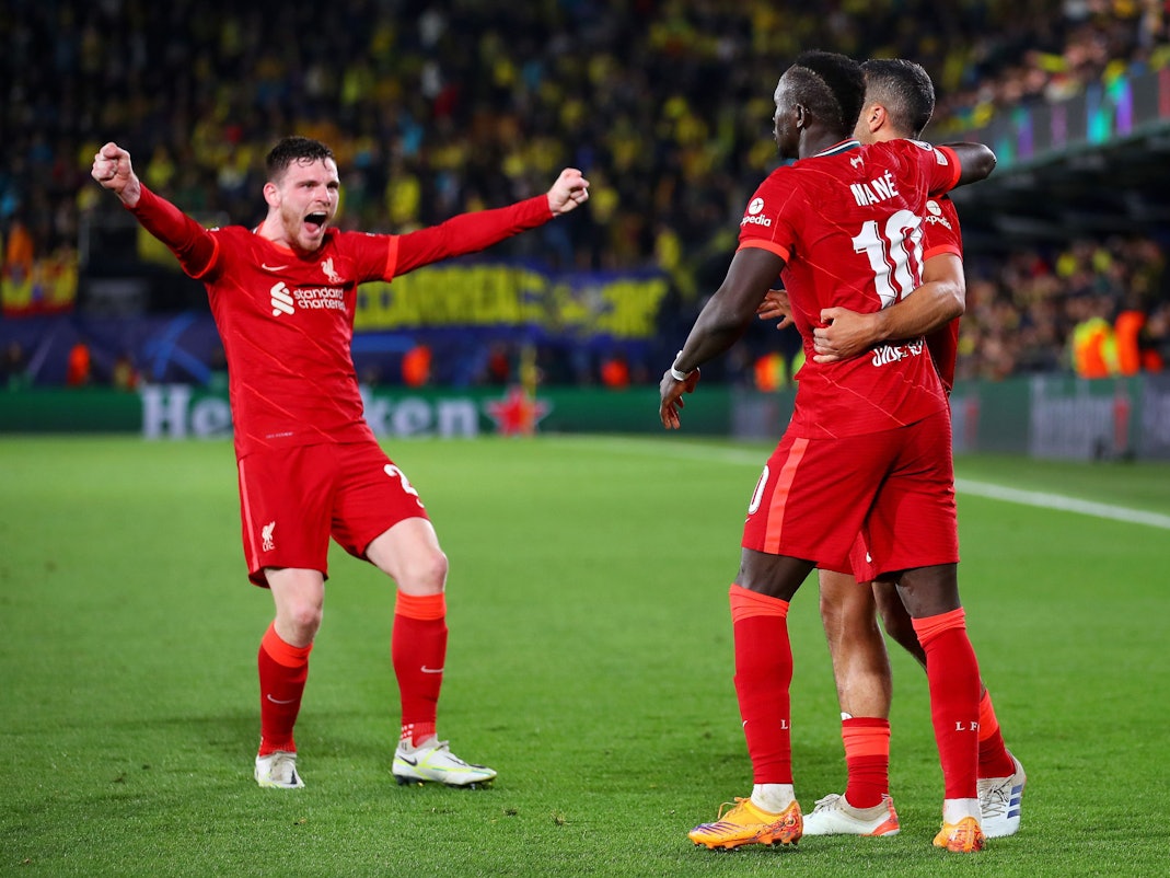 VILLARREAL, SPAIN - MAY 03: Sadio Mane celebrates with teammates Thiago Alcantara and Andrew Robertson of Liverpool after scoring their team's third goal during the UEFA Champions League Semi Final Leg Two match between Villarreal and Liverpool at Estadio de la Ceramica on May 03, 2022 in Villarreal, Spain. (Photo by Eric Alonso/Getty Images)