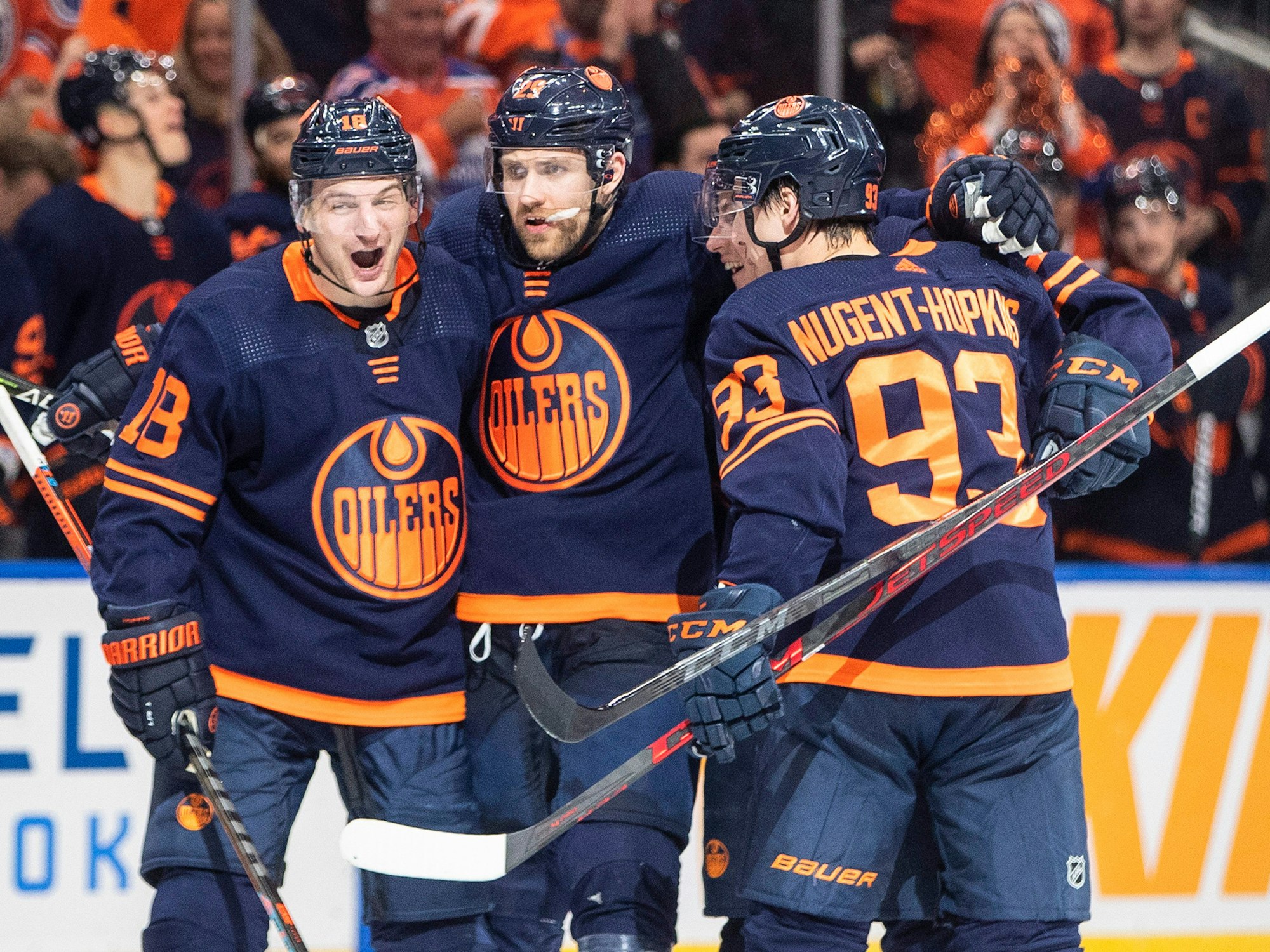 Edmonton Oilers' Zach Hyman (18), Leon Draisaitl (29) and Ryan Nugent-Hopkins (93) celebrate a goal against the Los Angeles Kings during the second period of Game 2 of an NHL hockey Stanley Cup playoffs first-round series Wednesday, May 4, 2022, in Edmonton, Alberta. (Jason Franson/The Canadian Press via AP)