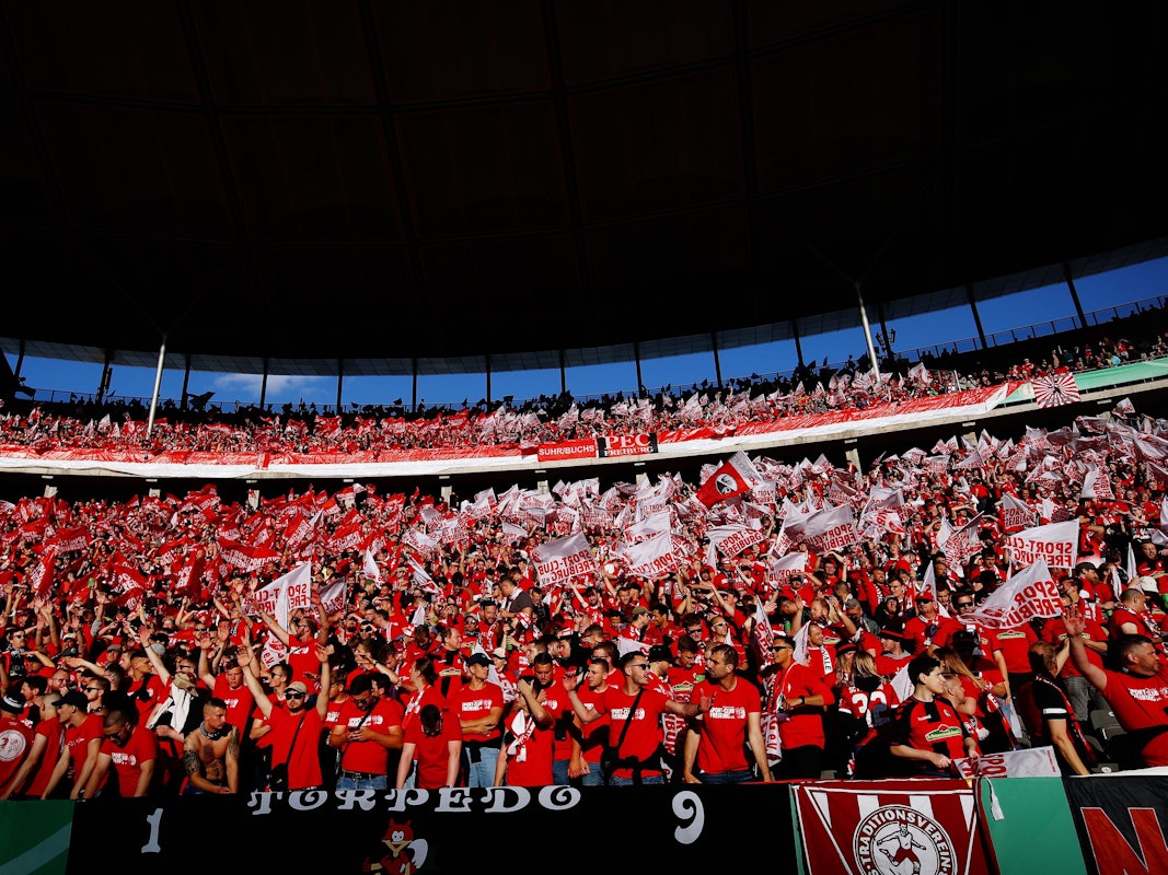 BERLIN, GERMANY - MAY 21: SC Freiburg fans show their support prior to the final match of the DFB Cup 2022 between SC Freiburg and RB Leipzig at Olympiastadion on May 21, 2022 in Berlin, Germany. (Photo by Dean Mouhtaropoulos/Getty Images)