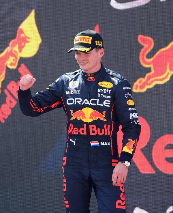 Red Bull's Dutch driver Max Verstappen celebrates on the podium after winning the Spanish Formula One Grand Prix at the Circuit de Catalunya on May 21, 2022 in Montmelo, on the outskirts of Barcelona. (Photo by LLUIS GENE / AFP)