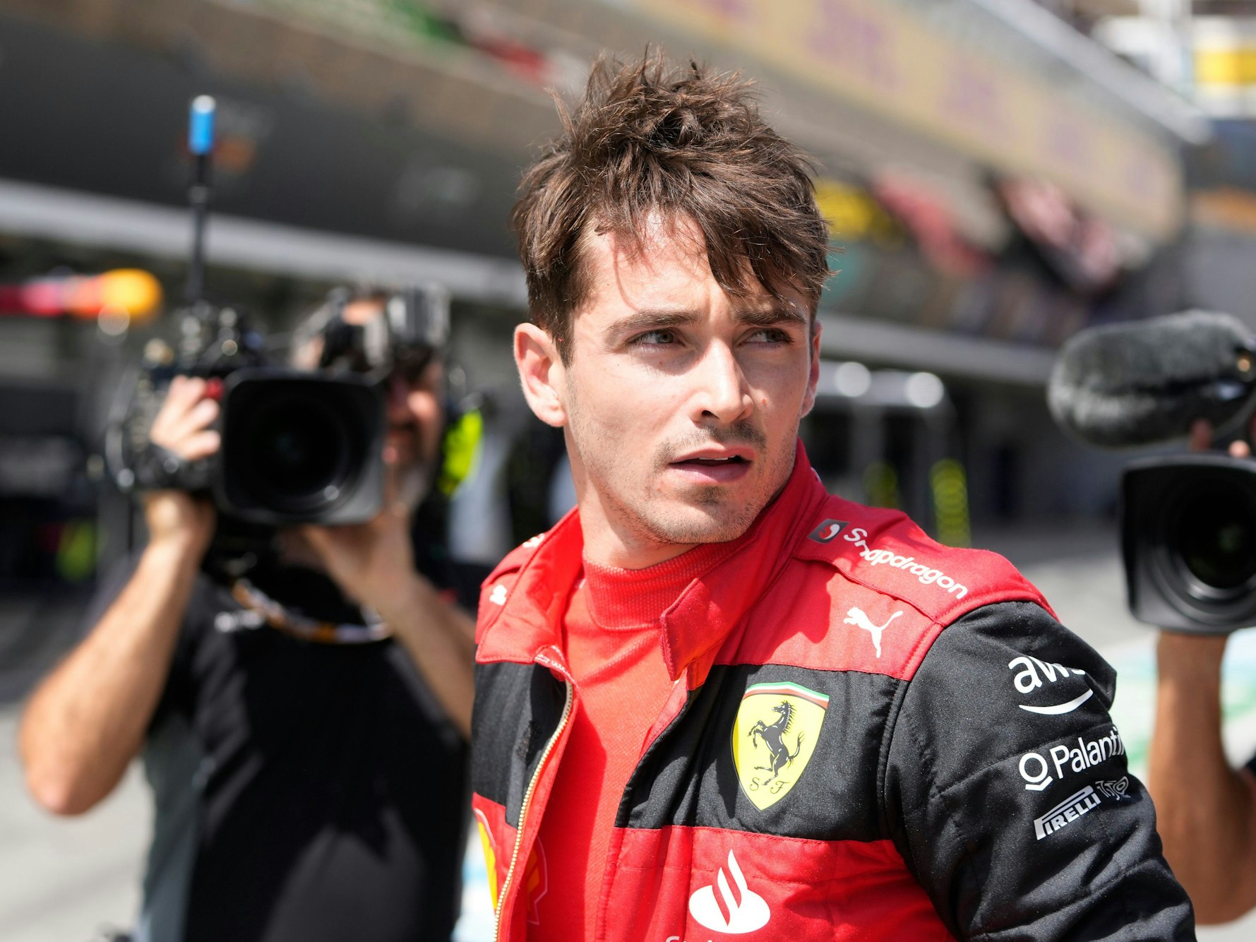 Ferrari driver Charles Leclerc of Monaco walks at the pit lane after his car's breakdown during the Spanish Formula One Grand Prix at the Barcelona Catalunya racetrack in Montmelo, Spain, Sunday, May 22, 2022. (AP Photo/Pool/Manu Fernandez)