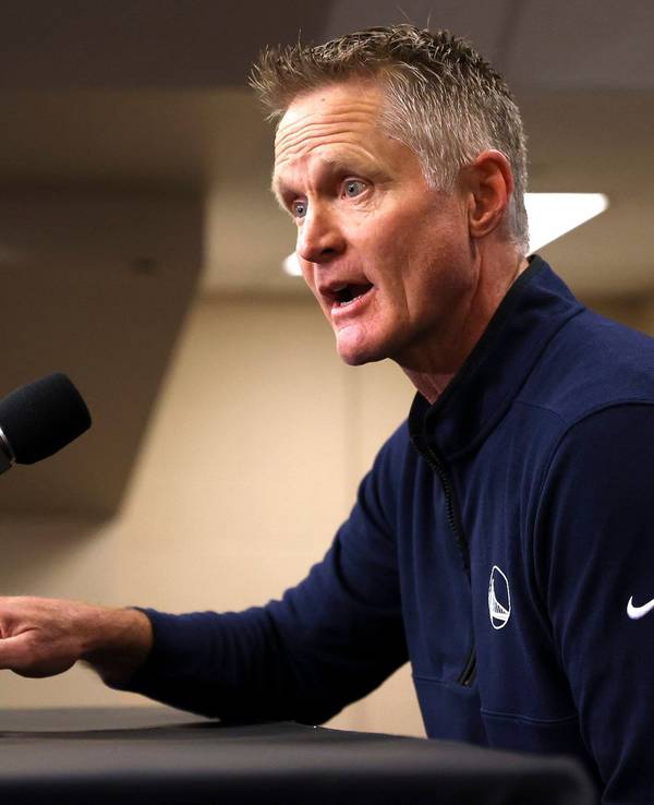 Reacting to the Uvalde, Texas, school shooting earlier in the day, Golden State Warriors coach Steve Kerr makes a statement before Warriors played the Dallas Mavericks in Game 4 of the NBA basketball playoffs Western Conference finals Tuesday, May 24, 2022, in Dallas. (Scott Strazzante/San Francisco Chronicle via AP)