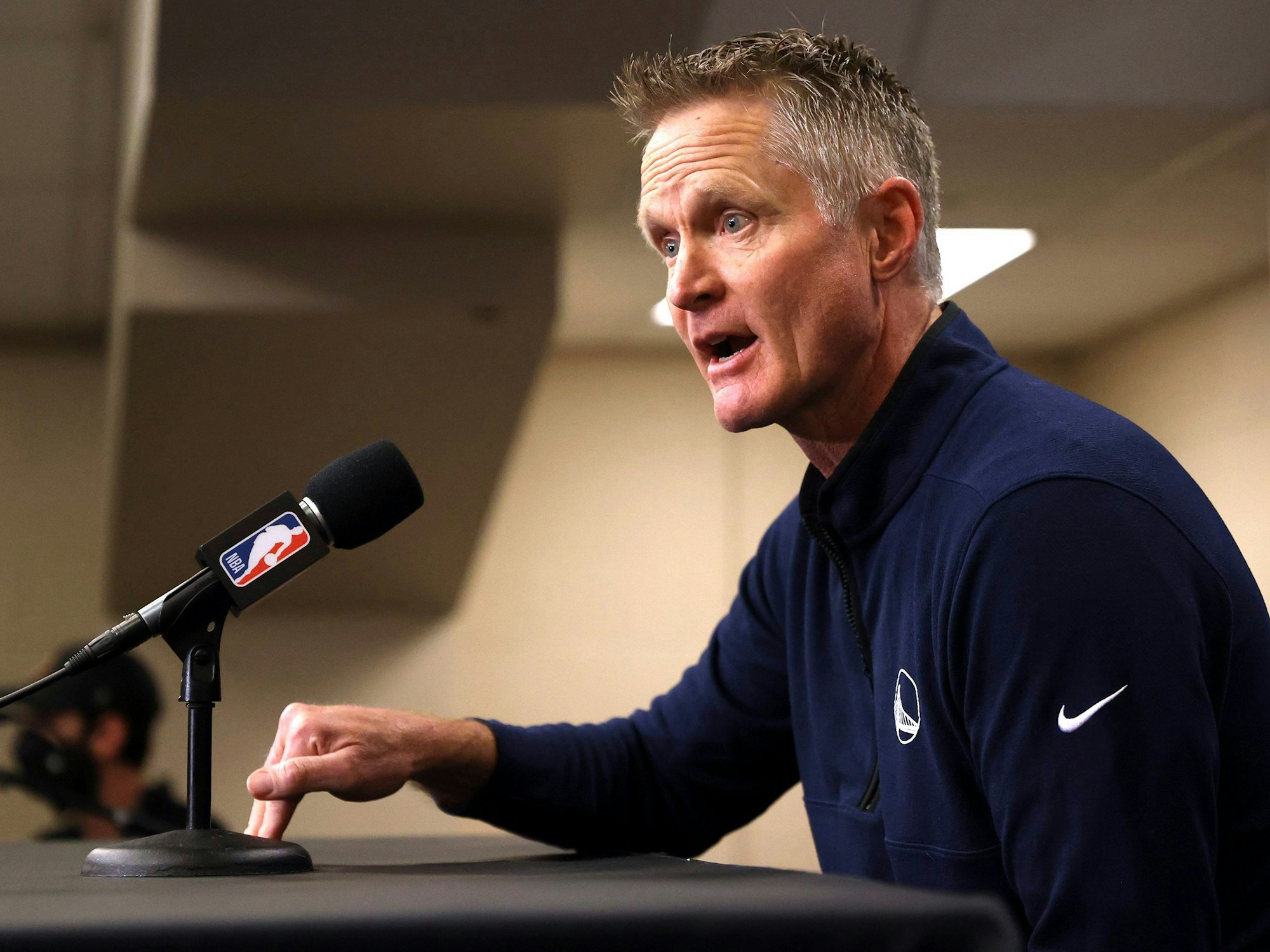 Reacting to the Uvalde, Texas, school shooting earlier in the day, Golden State Warriors coach Steve Kerr makes a statement before Warriors played the Dallas Mavericks in Game 4 of the NBA basketball playoffs Western Conference finals Tuesday, May 24, 2022, in Dallas. (Scott Strazzante/San Francisco Chronicle via AP)