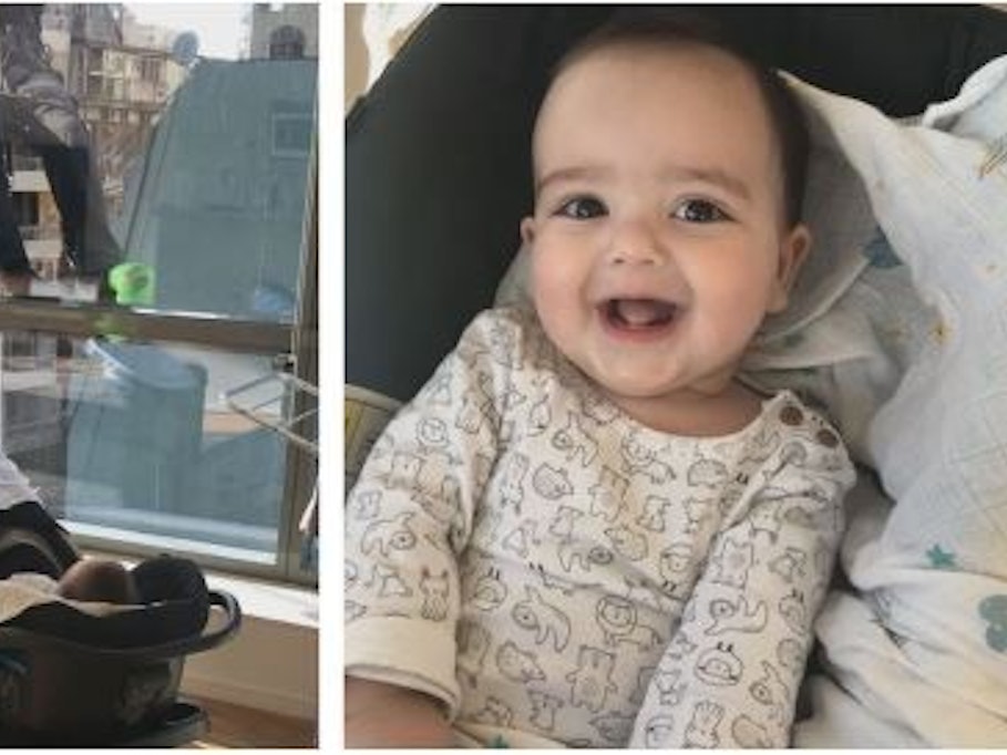 Ein Baby aus Argentinien gluckst und lacht mitreißend, als Fensterputzer die Scheiben der Wohnung säubern.