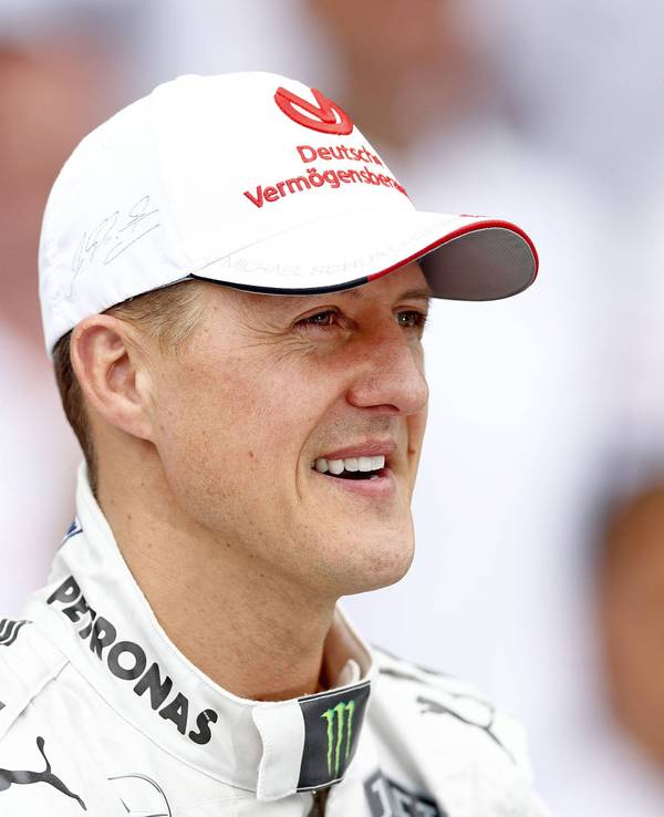 Michael Schumacher, mit guter Laune, schaut sich 2012 das Rennen in Brasilien an.