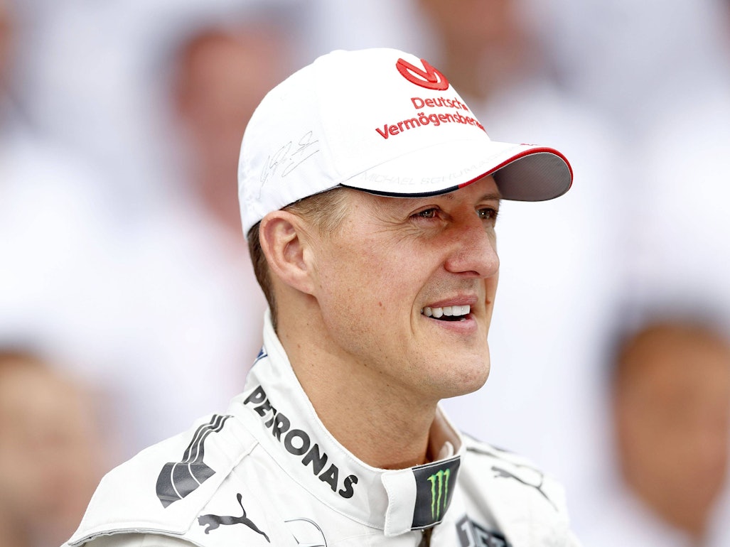 Michael Schumacher, mit guter Laune, schaut sich 2012 das Rennen in Brasilien an.