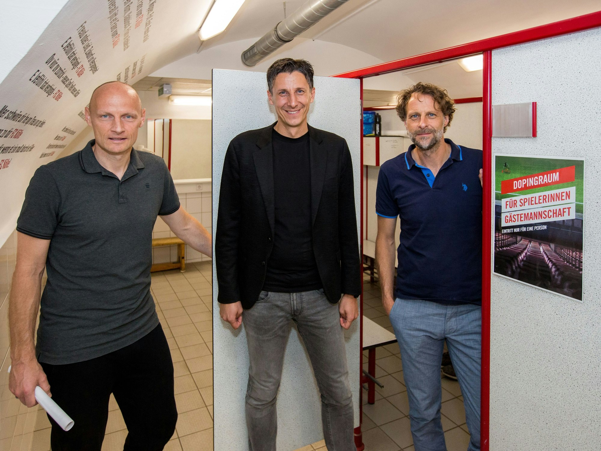 Matthias Heidrich, Christian Keller und Carsten Schiel posieren im Kölner Nachwuchsleistungszentrum.