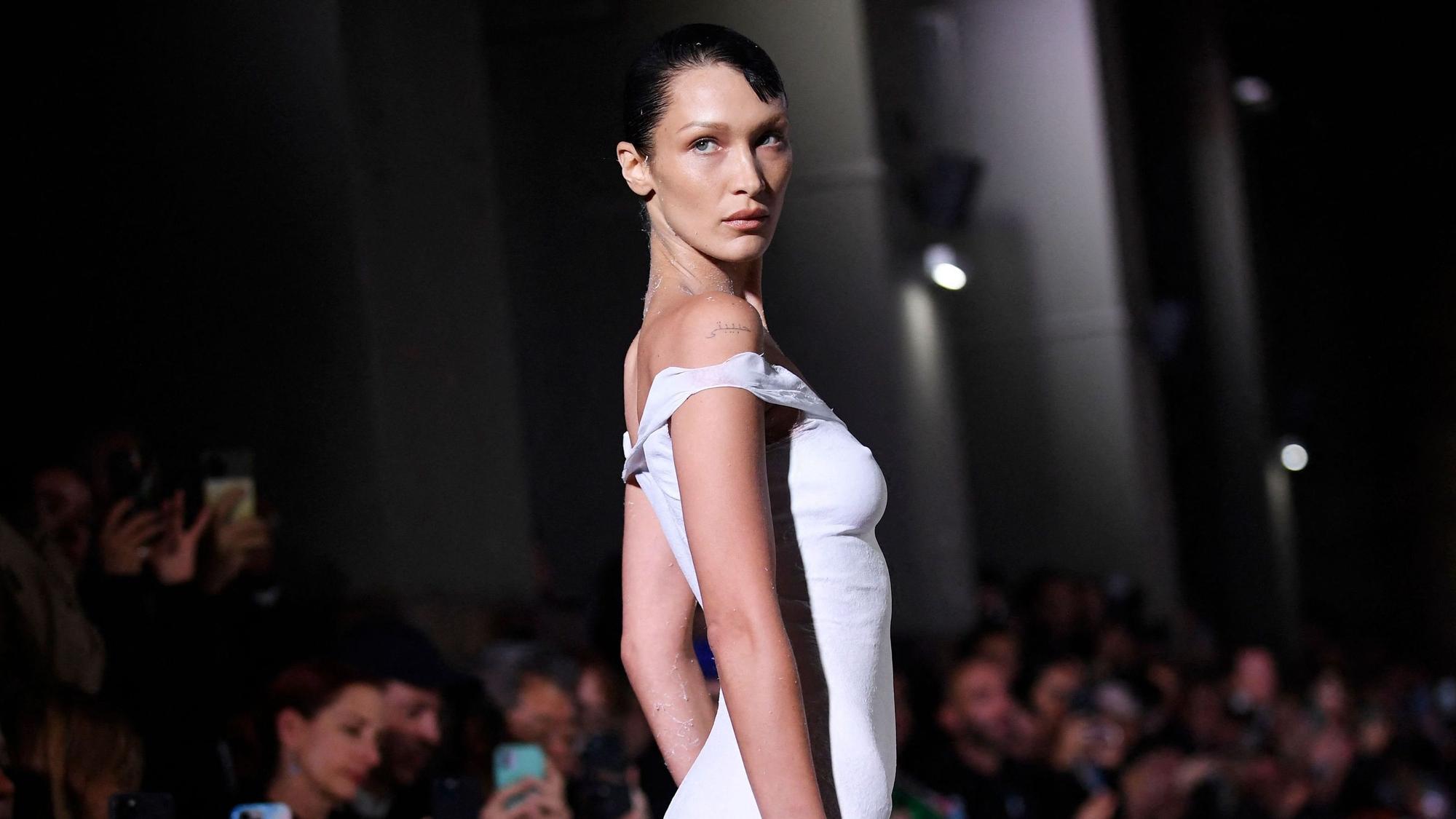 US model Bella Hadid presents a creation during the Coperni Spring-Summer 2023 fashion show as part of the Paris Womenswear Fashion Week, in Paris, on September 30, 2022. (Photo by JULIEN DE ROSA / AFP)