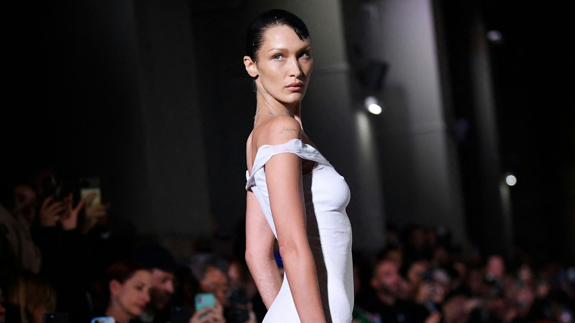 US model Bella Hadid presents a creation during the Coperni Spring-Summer 2023 fashion show as part of the Paris Womenswear Fashion Week, in Paris, on September 30, 2022. (Photo by JULIEN DE ROSA / AFP)
