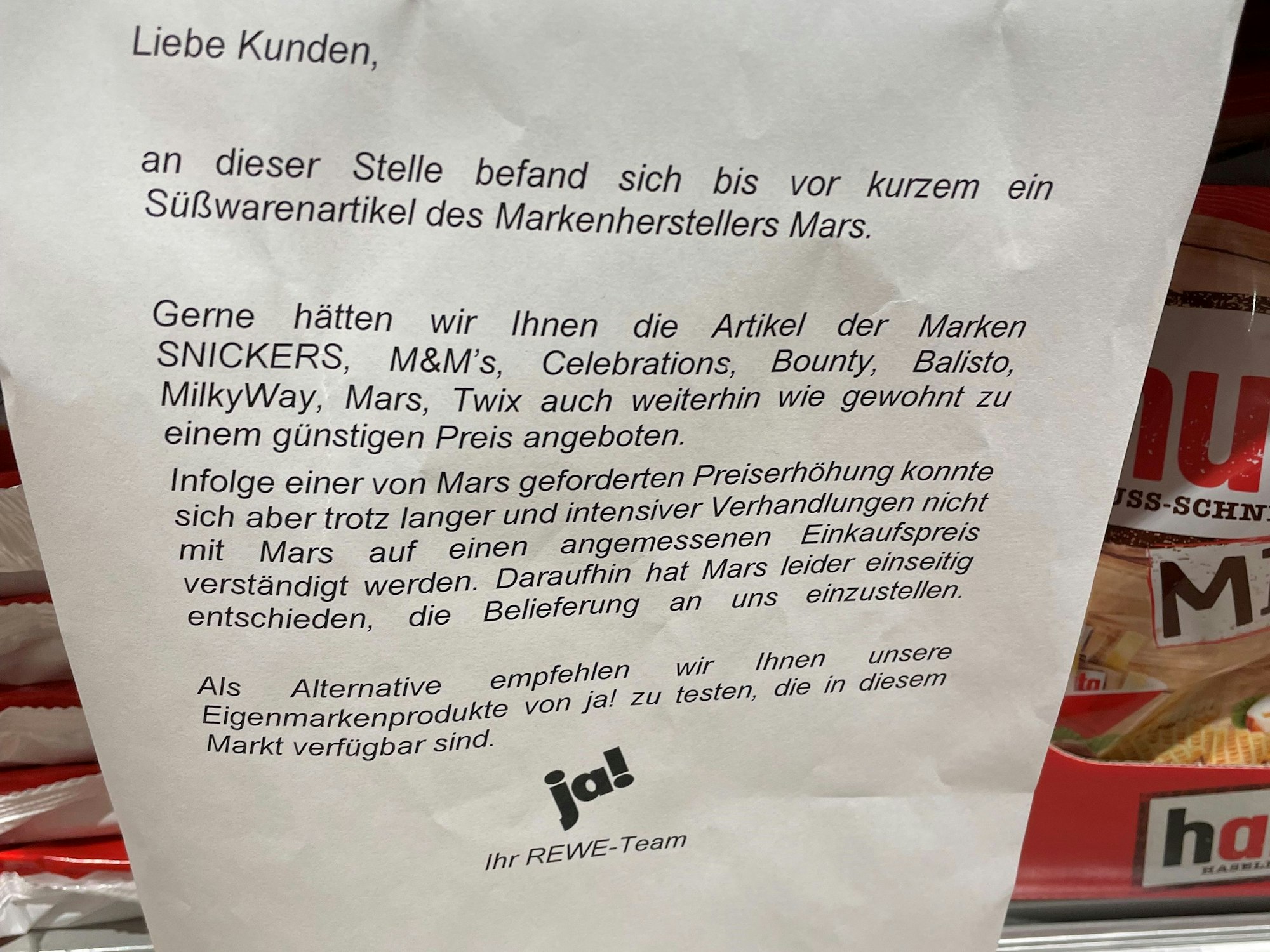 Aushang in einem REWE-Markt.