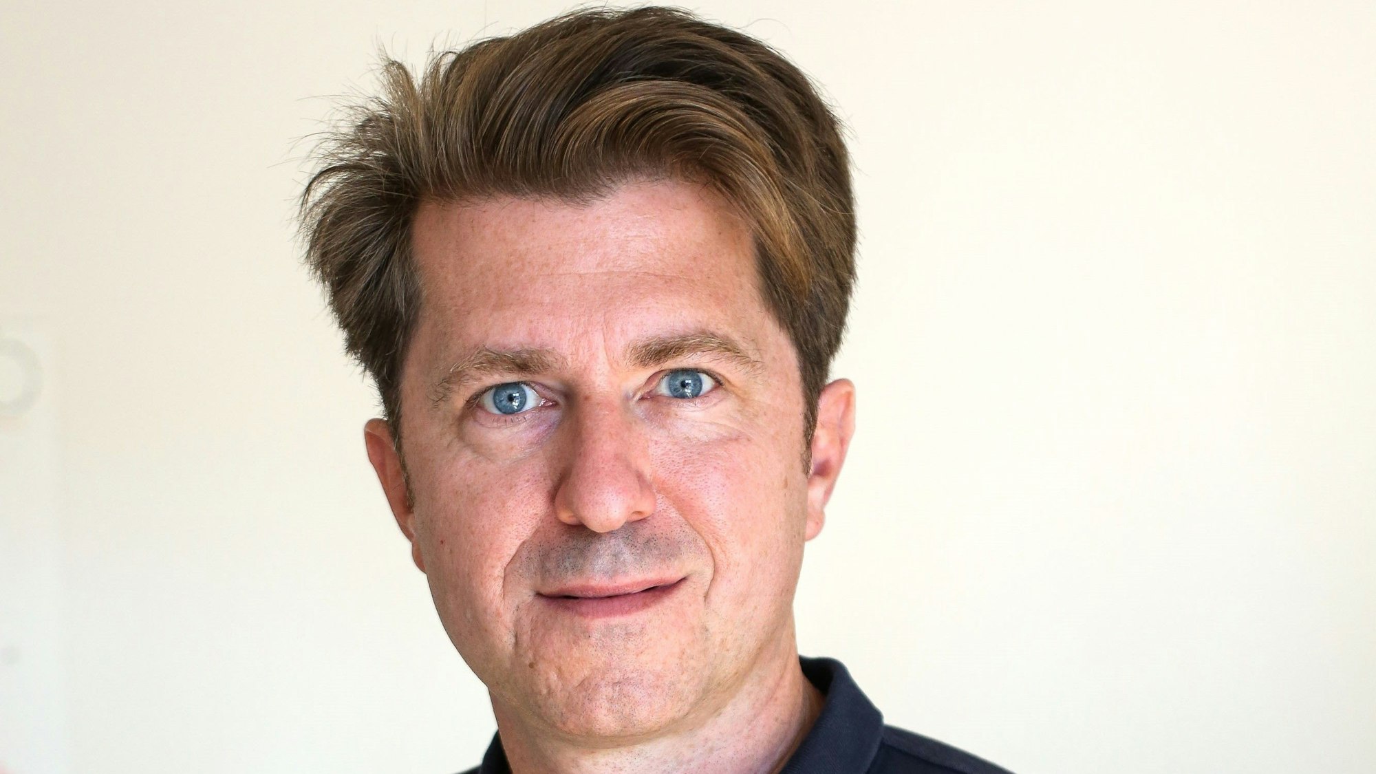 Janning Vygen von der Tippspiel-App Kicktipp schaut in die Kamera