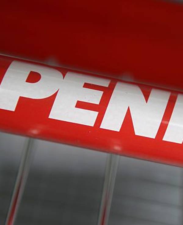 Ein Penny-Logo auf einem Einkaufswagen.