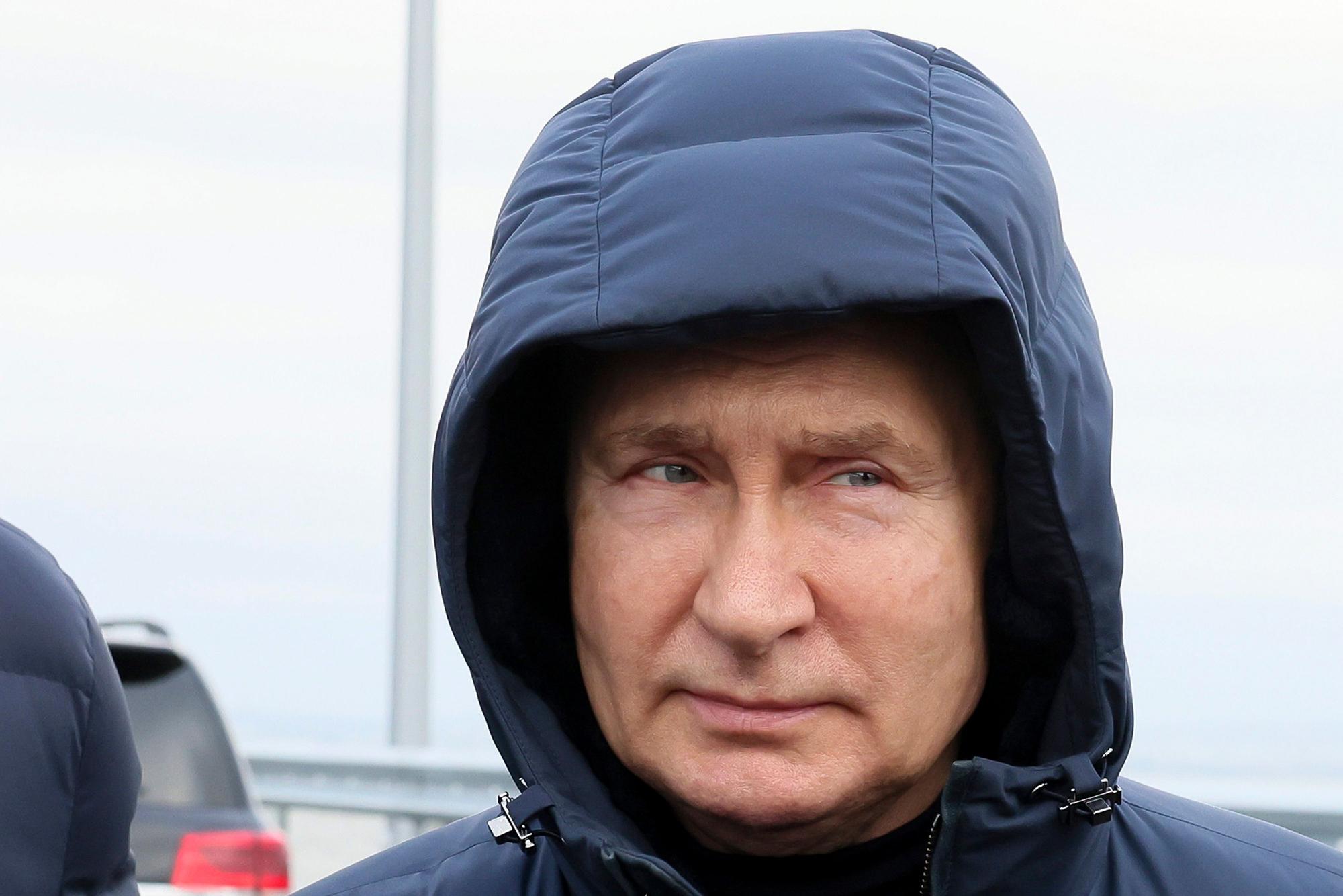 FILE - Russian President Vladimir Putin visits the Crimean Bridge connecting Russian mainland and Crimean peninsula over the Kerch Strait, which was damaged by a truck bomb attack in October, after restoration works, not far from Kerch, Crimea, Monday, Dec. 5, 2022. In Russia, there is a growing sense of desperation among hard-liners about what they see as President Vladimir Putin's hesitancy and lack of a clear strategy. (Mikhail Metzel, Sputnik, Kremlin Pool Photo via AP, File)