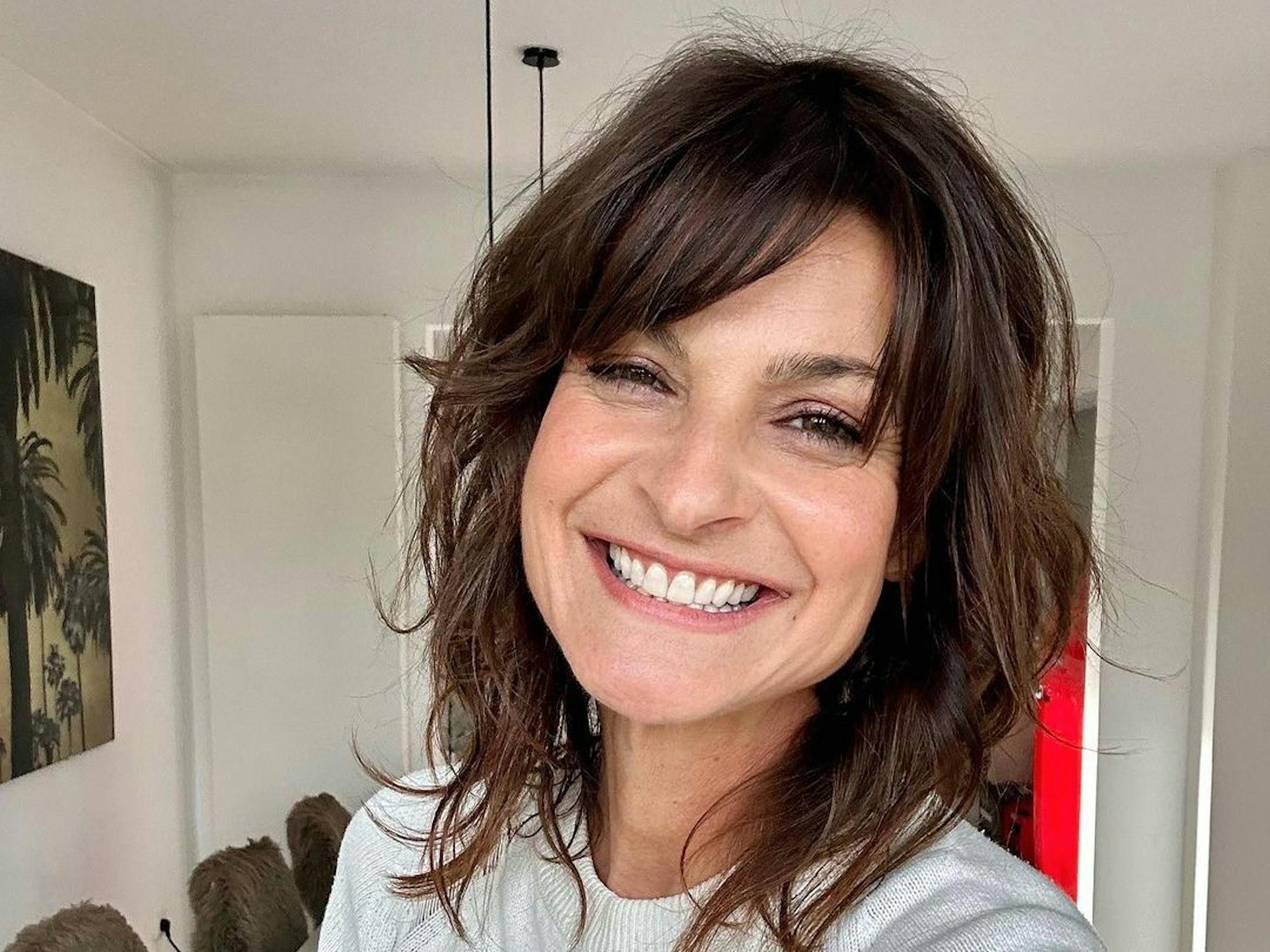 Das Selfie zeigt die Sat.1-„Frühstücksfernsehen“-Moderatorin Marlene Lufen, die breit in die Kamera grinst.