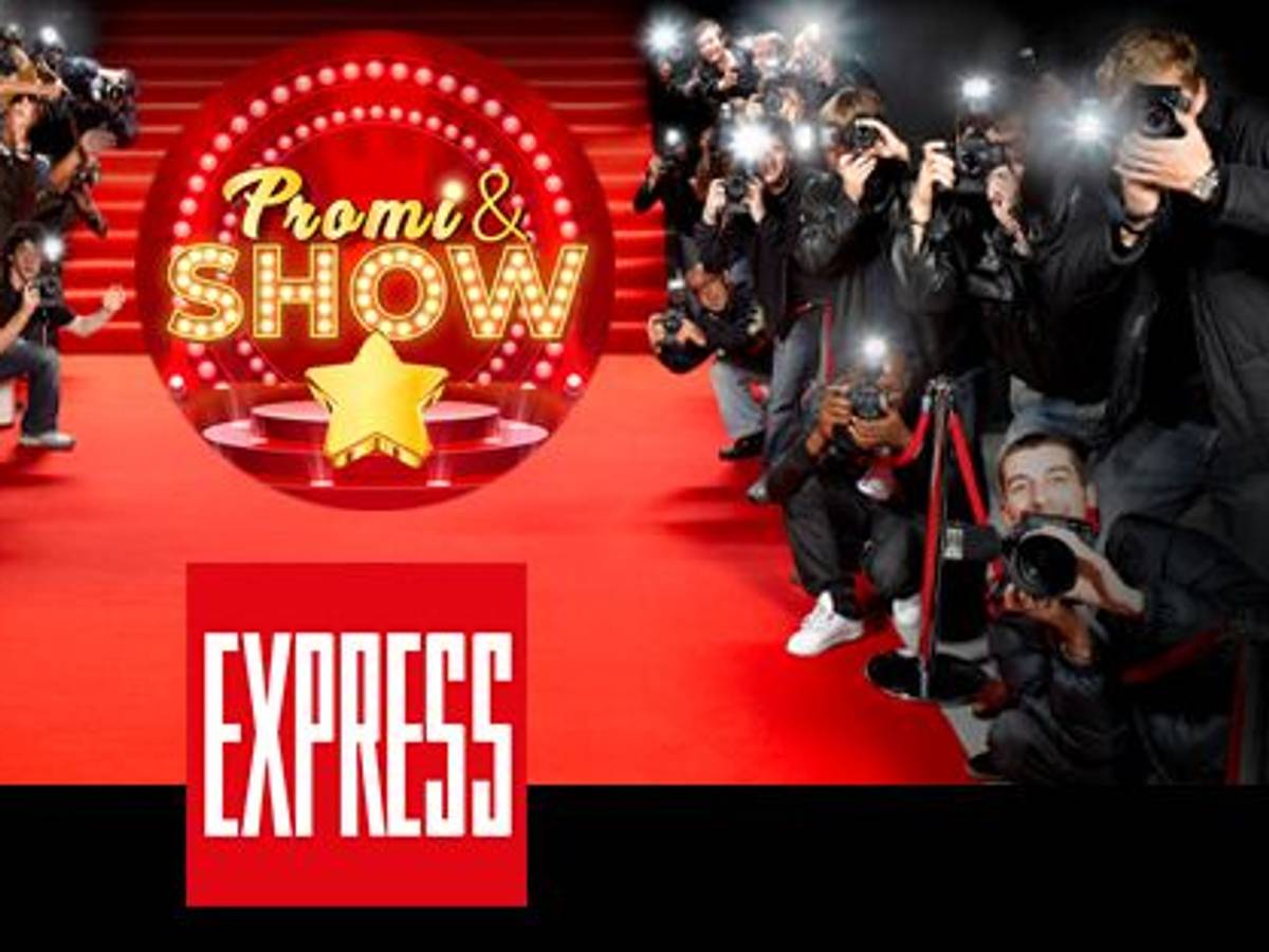 Fotografen am roten Teppich, auf dem das Logo des EXPRESS und von Promi & Show zu sehen sind.
