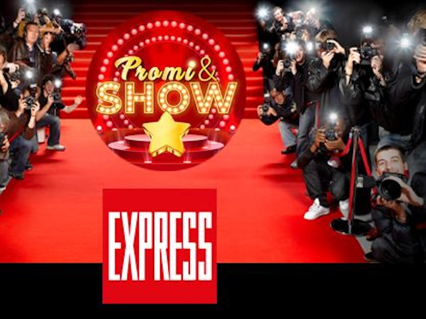 Fotografen am roten Teppich, auf dem das Logo des EXPRESS und von Promi & Show zu sehen sind.