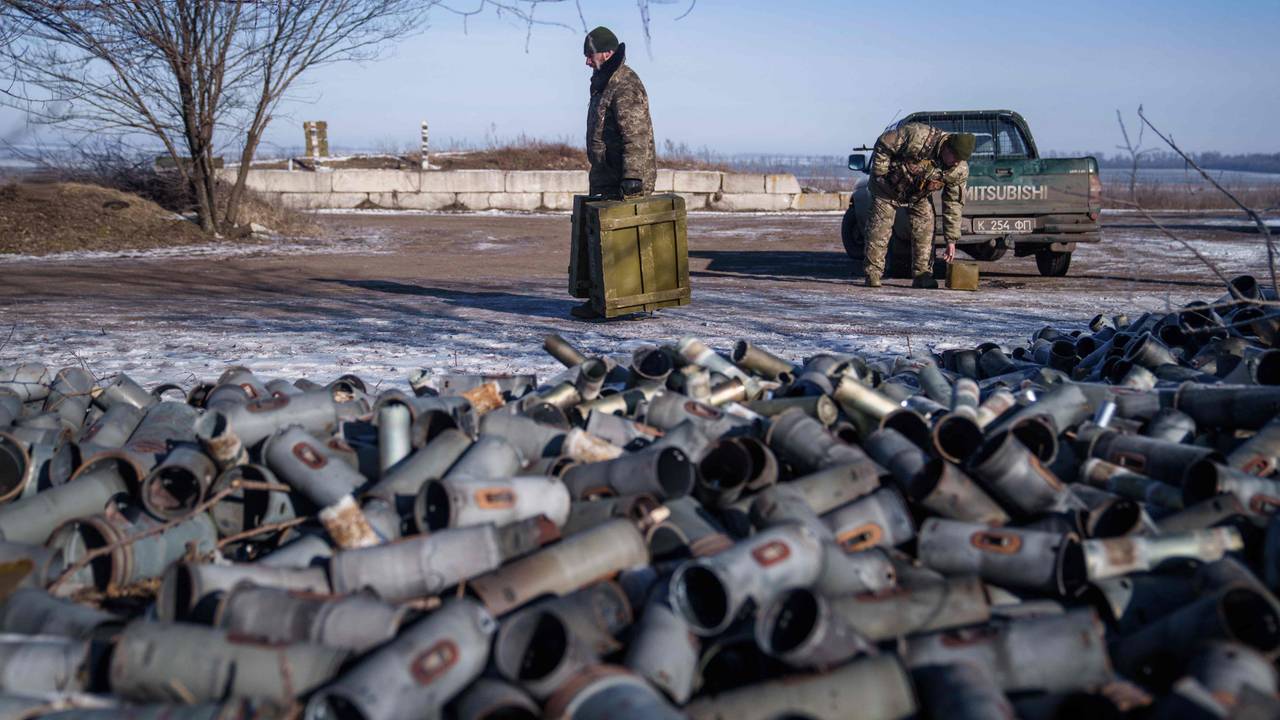 TOPSHOT - A Helicopter crew member of the 18th Separate Army Aviation Brigade carries boxes of ammunition, in eastern Ukraine on February 9, 2023 amid Russia's military invasion on Ukraine. (Photo by Ihor Tkachov / AFP)