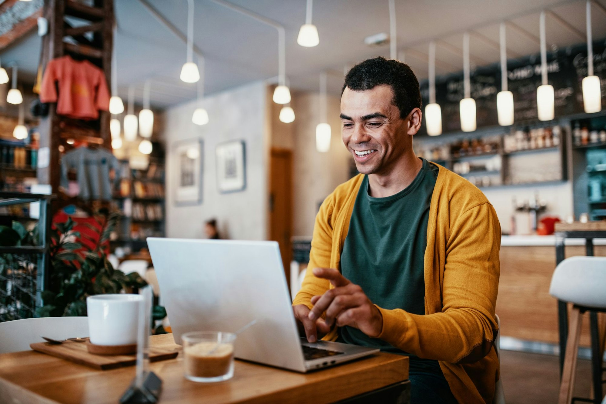 Mid adult or mature man using laptop for personal finances, electronic banking or remote work